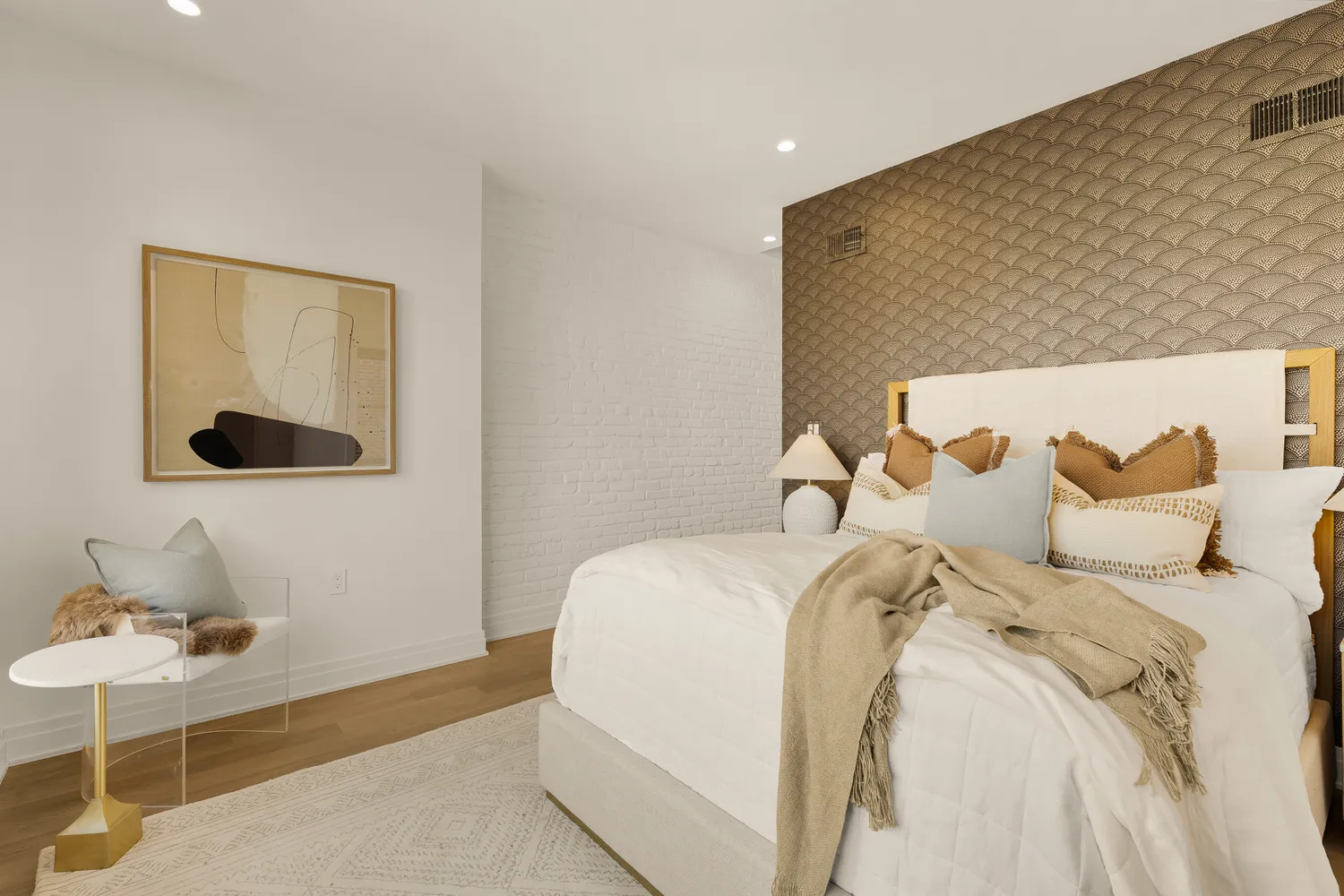 a bedroom with a large bed and a large window