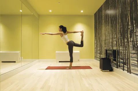 a view of room with windows book shelves