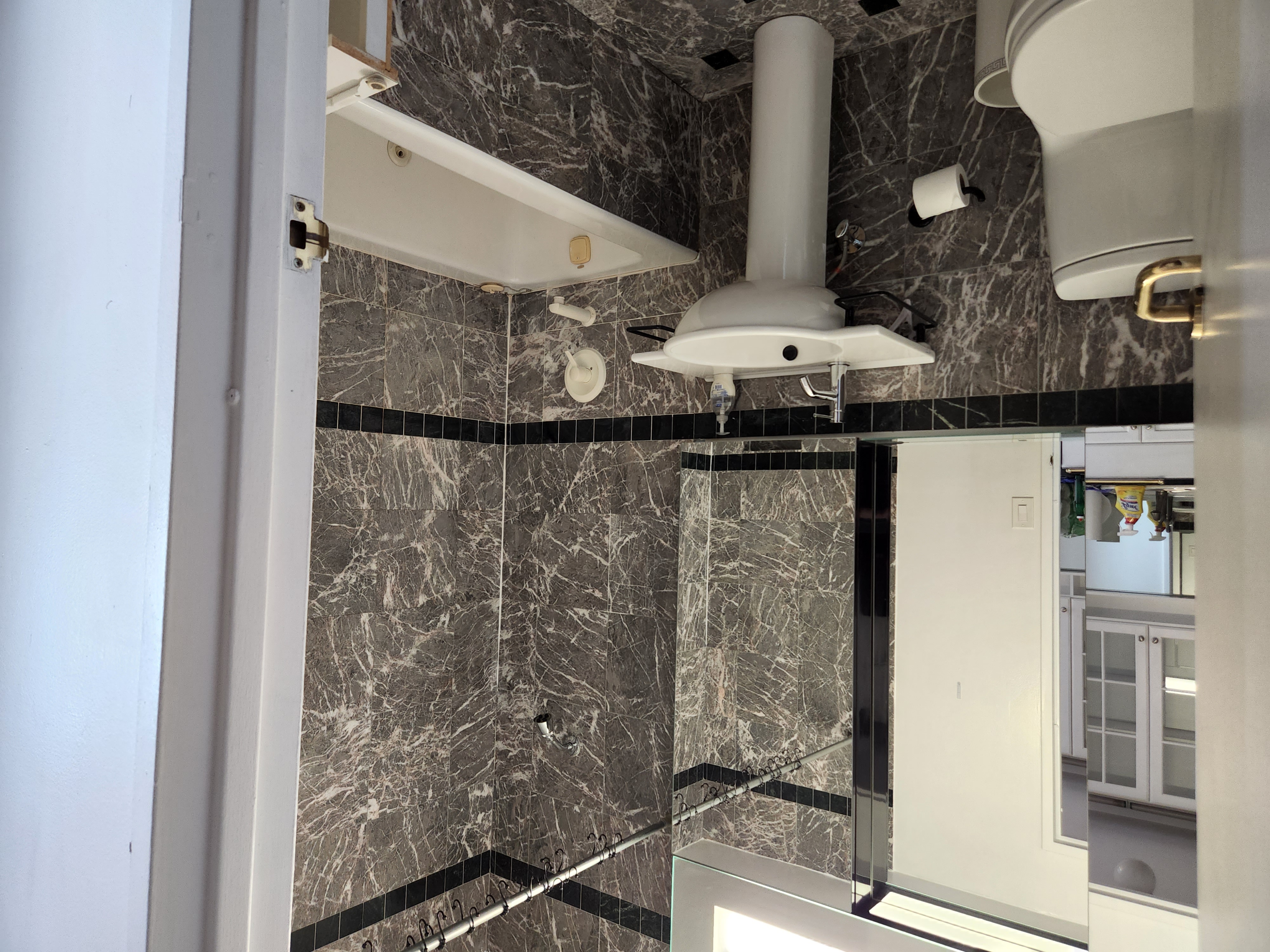 250 East 54th Street, Unit 14E Manhattan, NY 10022 - Photo 2 of 5 a bathroom with a sink mirror toilet and bathtub