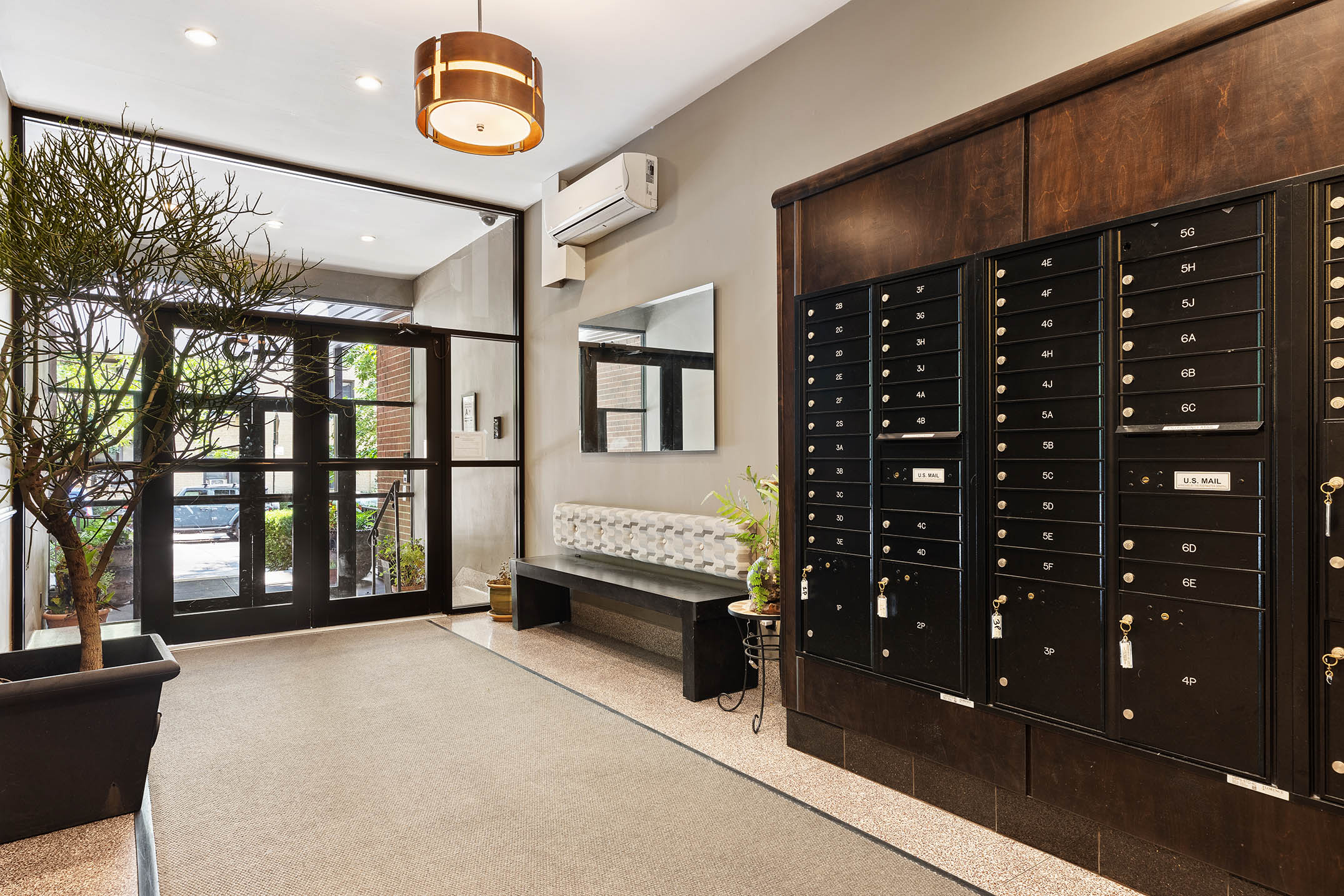 45 Overlook Terrace, Unit 3A Manhattan, NY 10033 - Photo 7 of 9 a bedroom with a bed a dresser and a large window