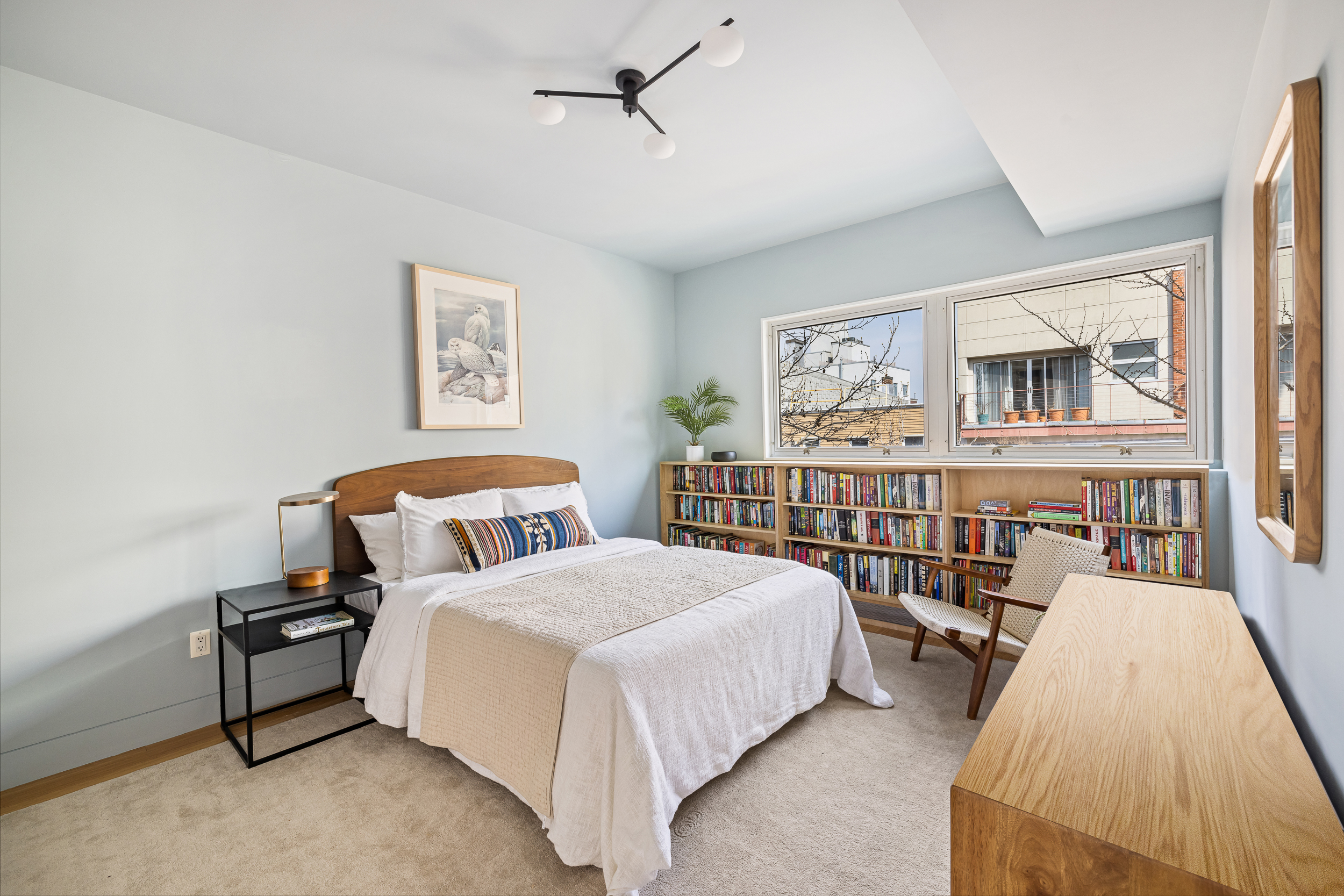 361 Manhattan Avenue, Unit 3AB Brooklyn, NY 11211 - Photo 10 of 21 a spacious bedroom with a bed and a table