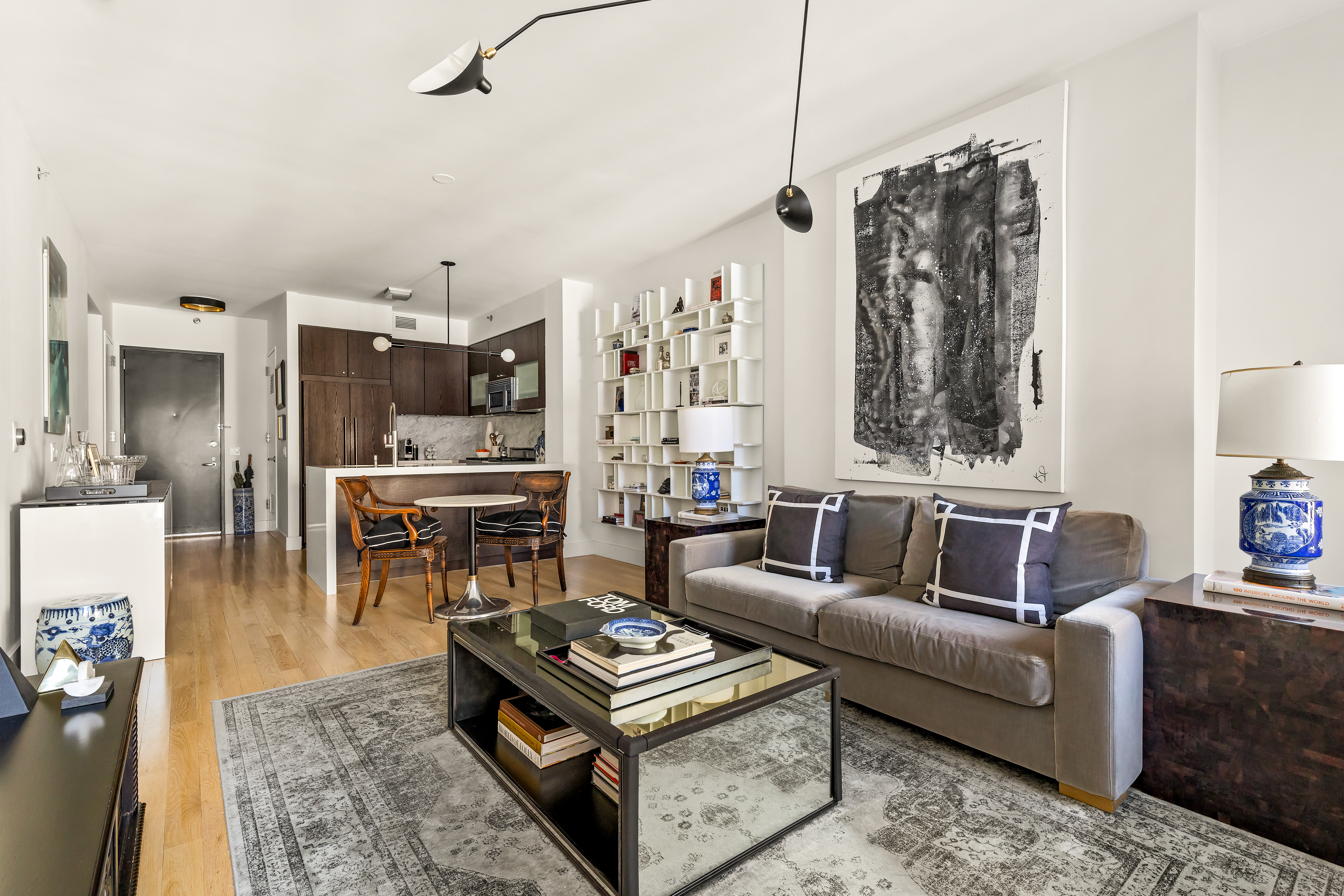 454 West 54th Street, Unit 5G Manhattan, NY 10019 - Photo 2 of 17 a living room with furniture and a large window