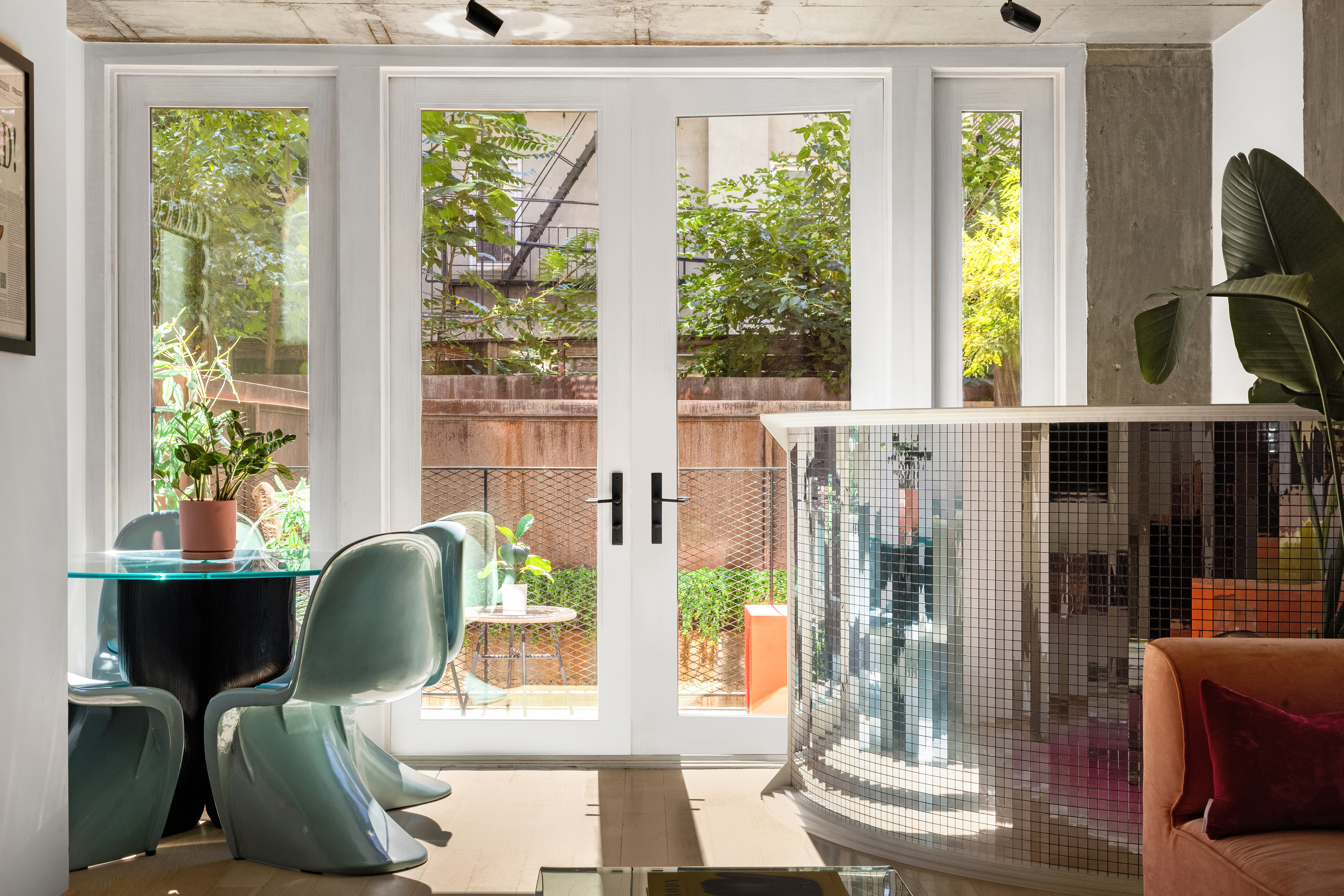 126 South 2nd Street, Unit GARDEN Brooklyn, NY 11249 - Photo 8 of 30 a view of a dining room with furniture and windows