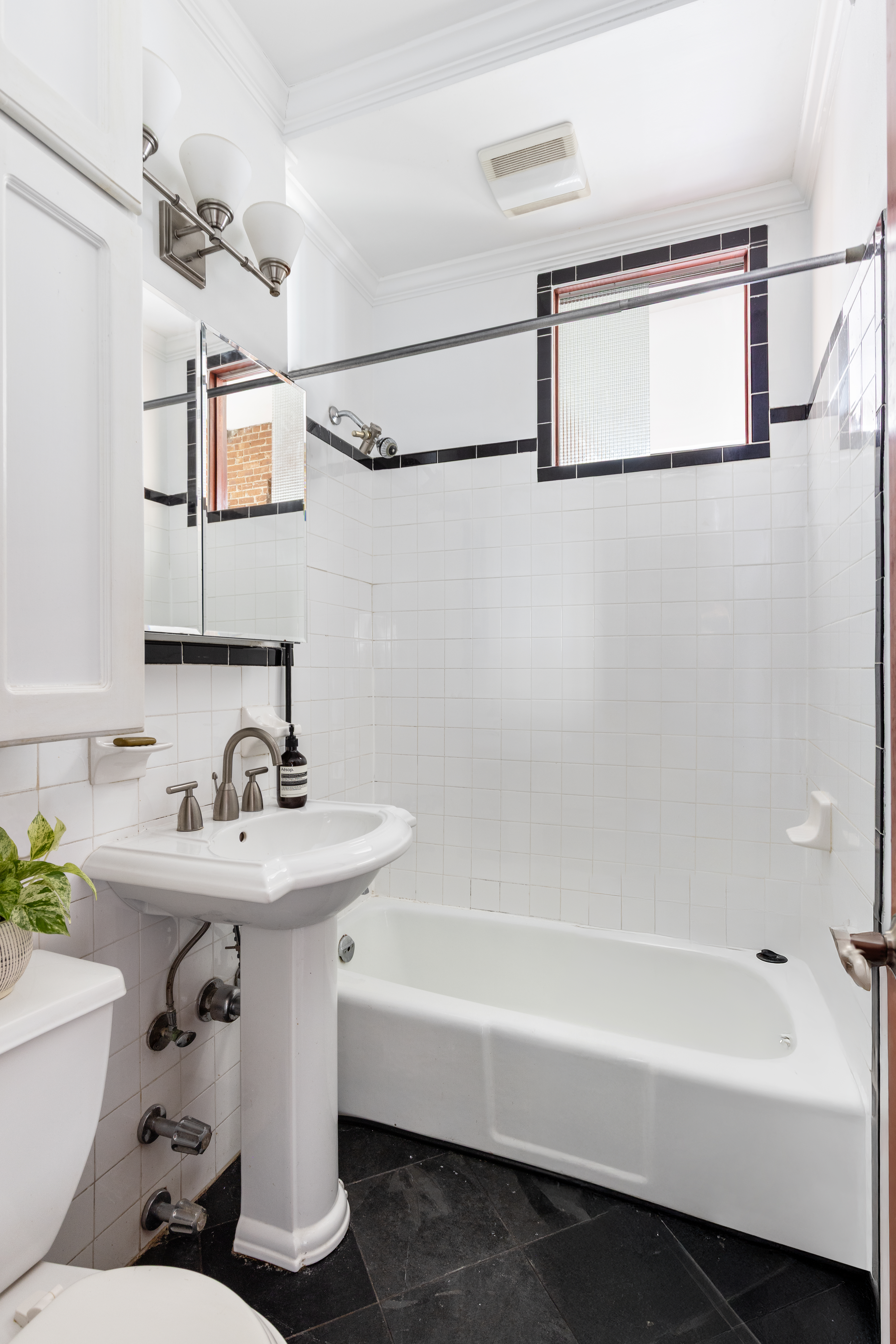 327 West 85th Street, Unit 5D Manhattan, NY 10024 - Photo 7 of 11 a bathroom with a sink mirror toilet and bathtub