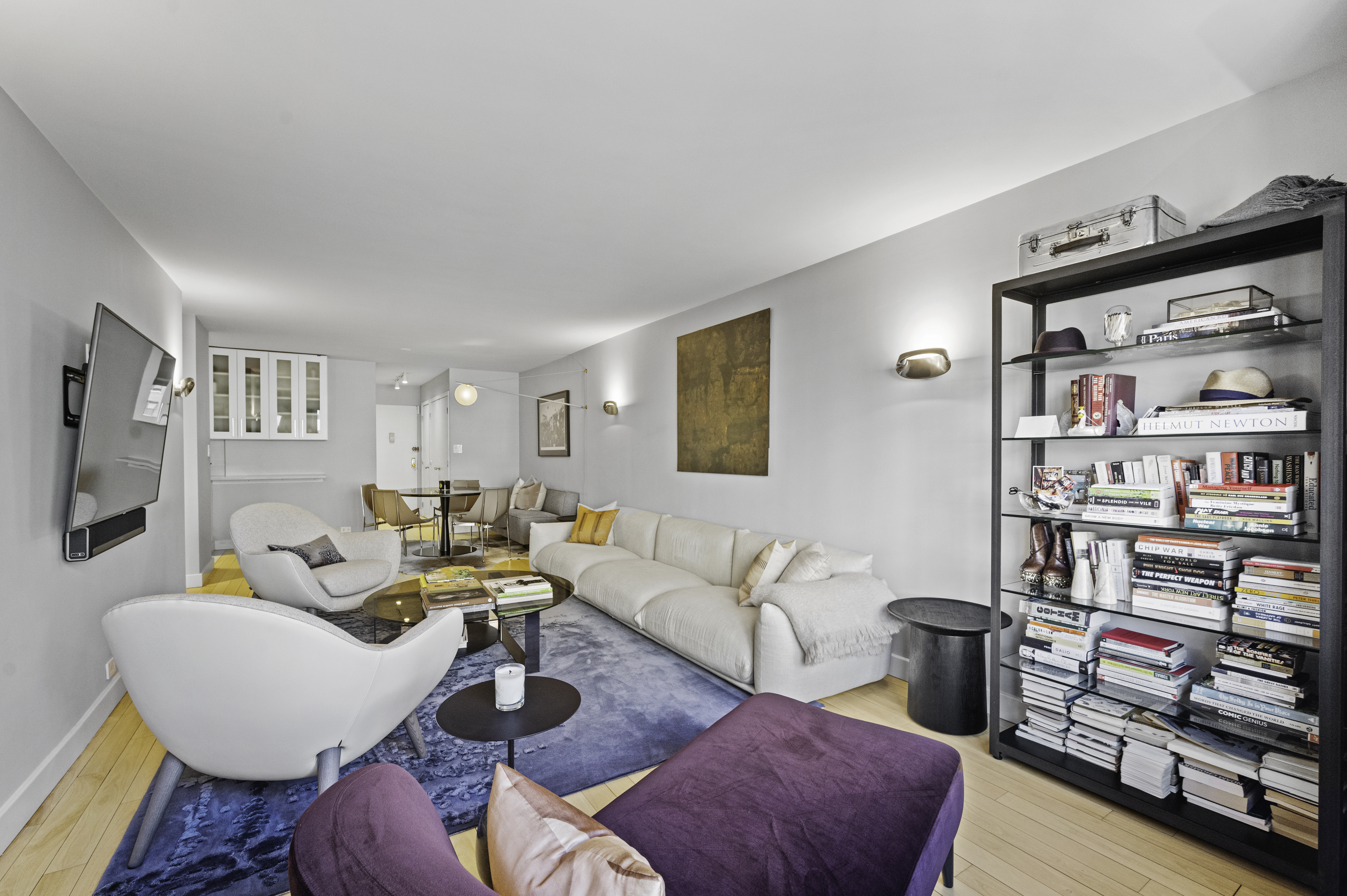 301 East 62nd Street, Unit 7K Manhattan, NY 10065 - Photo 2 of 14 a living room with furniture fireplace and a window