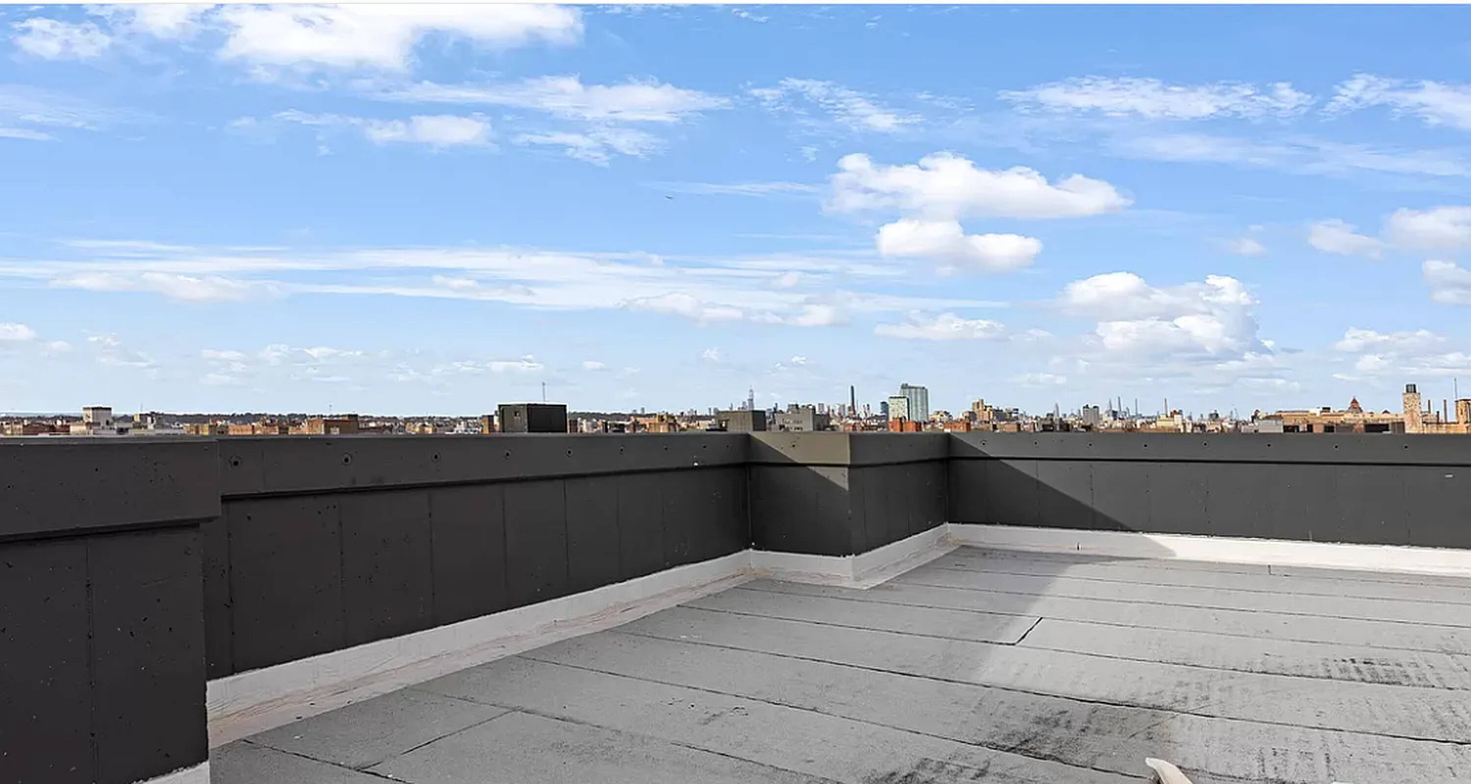 485 East 28th Street Brooklyn, NY 11226 - Photo 15 of 17 a view of a terrace with a bench