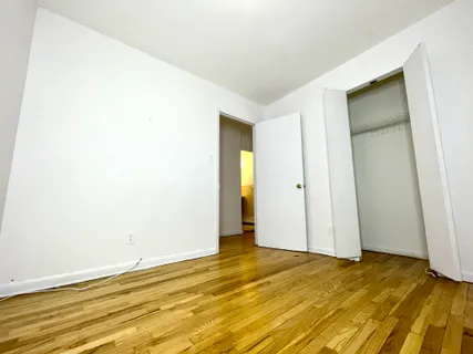 a view of an empty room with windows