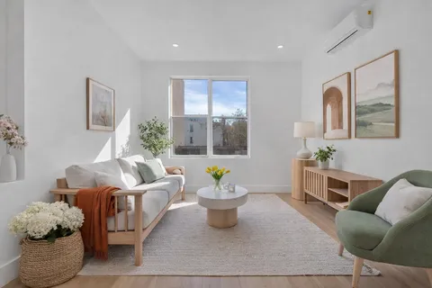 a living room with furniture and window