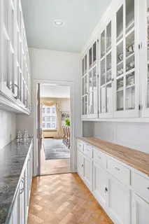 a view of a kitchen with a sink and cabinets