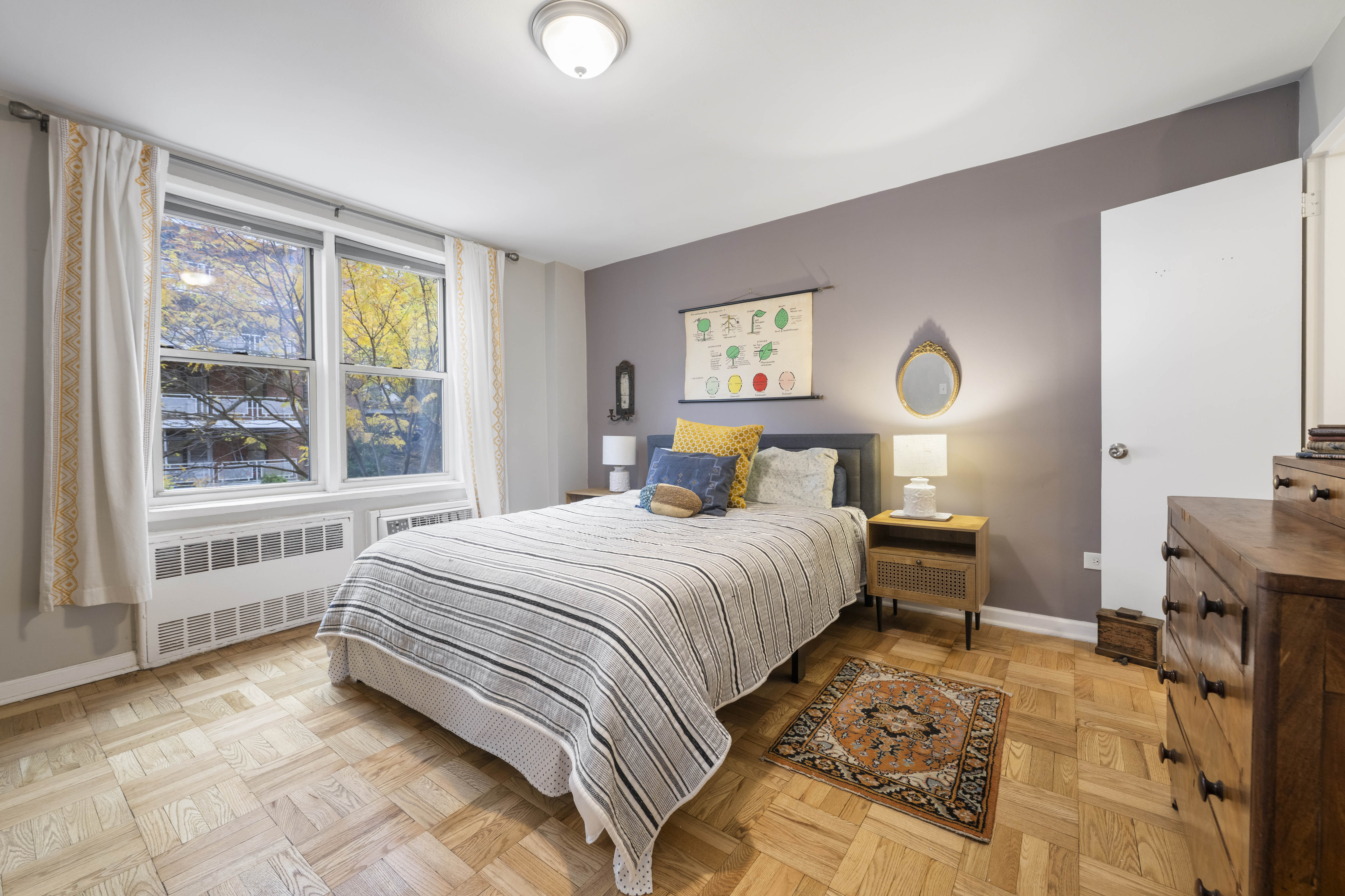 255 Fieldston Terrace, Unit 2L Bronx, NY 10471 - Photo 8 of 14 a bedroom with a bed and a large window