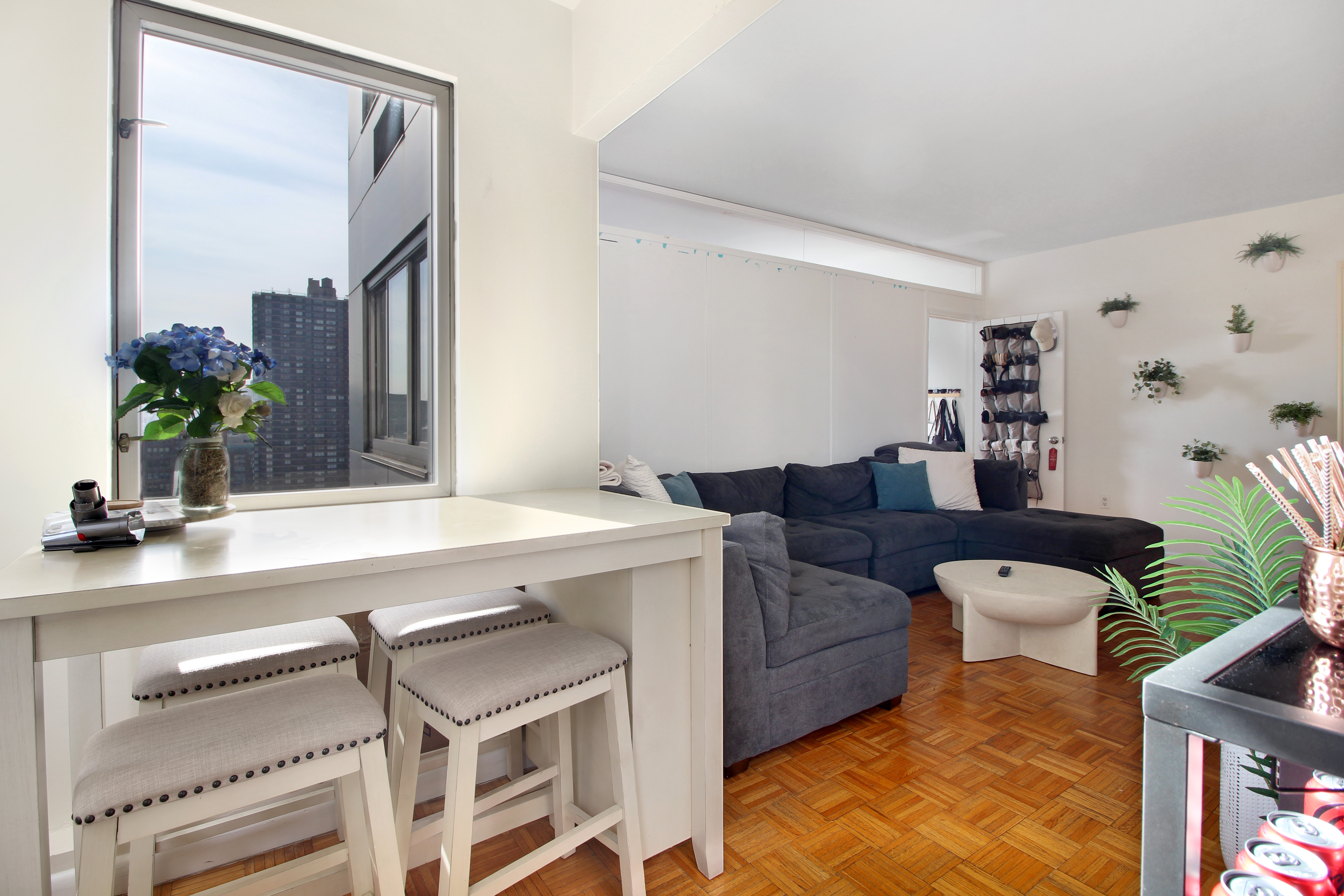 308 East 38th Street, Unit 20A Manhattan, NY 10016 - Photo 2 of 13 a living room with furniture and potted plant
