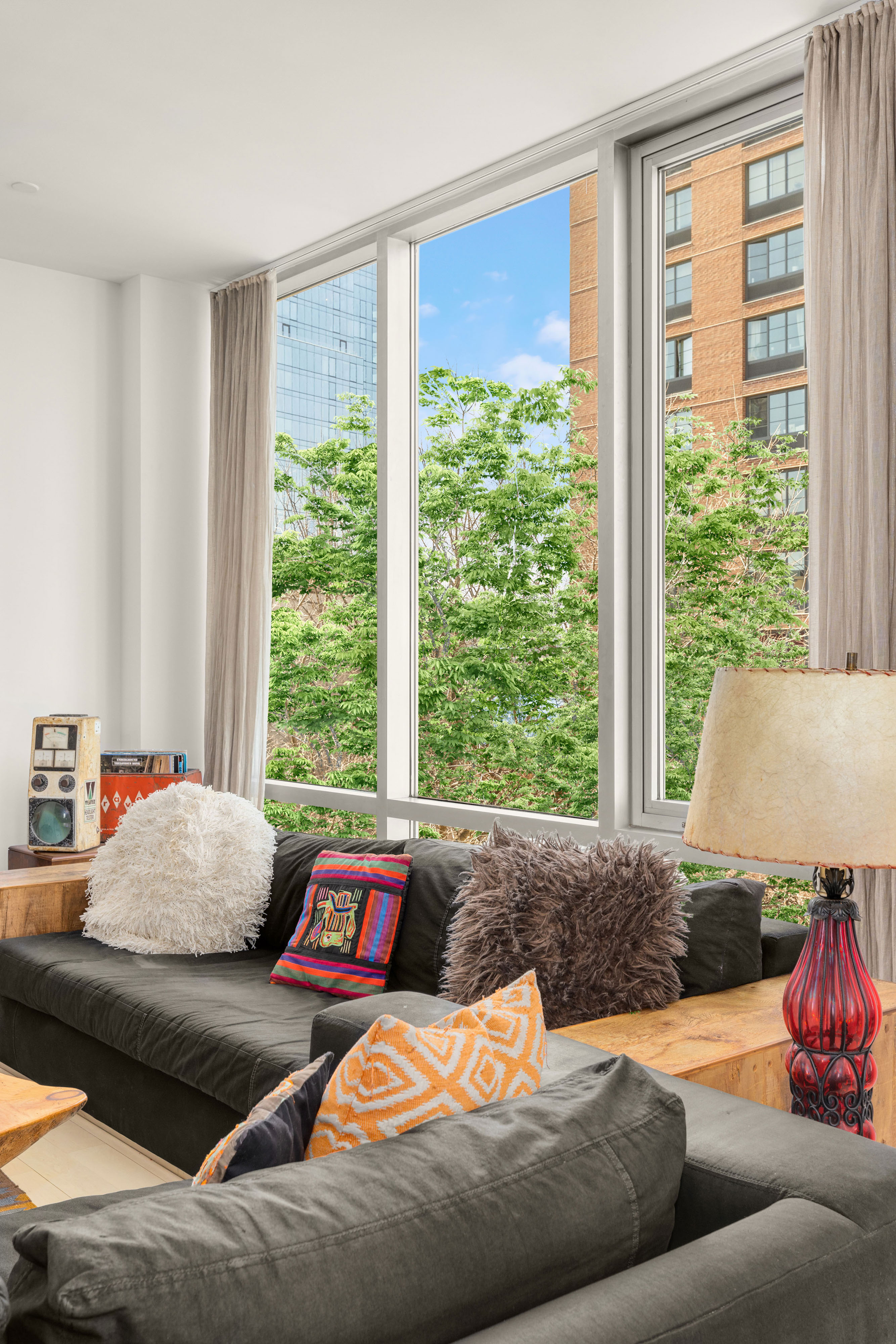 24 Dunham Place, Unit PHA Brooklyn, NY 11249 - Photo 6 of 19 a living room with furniture and a large window