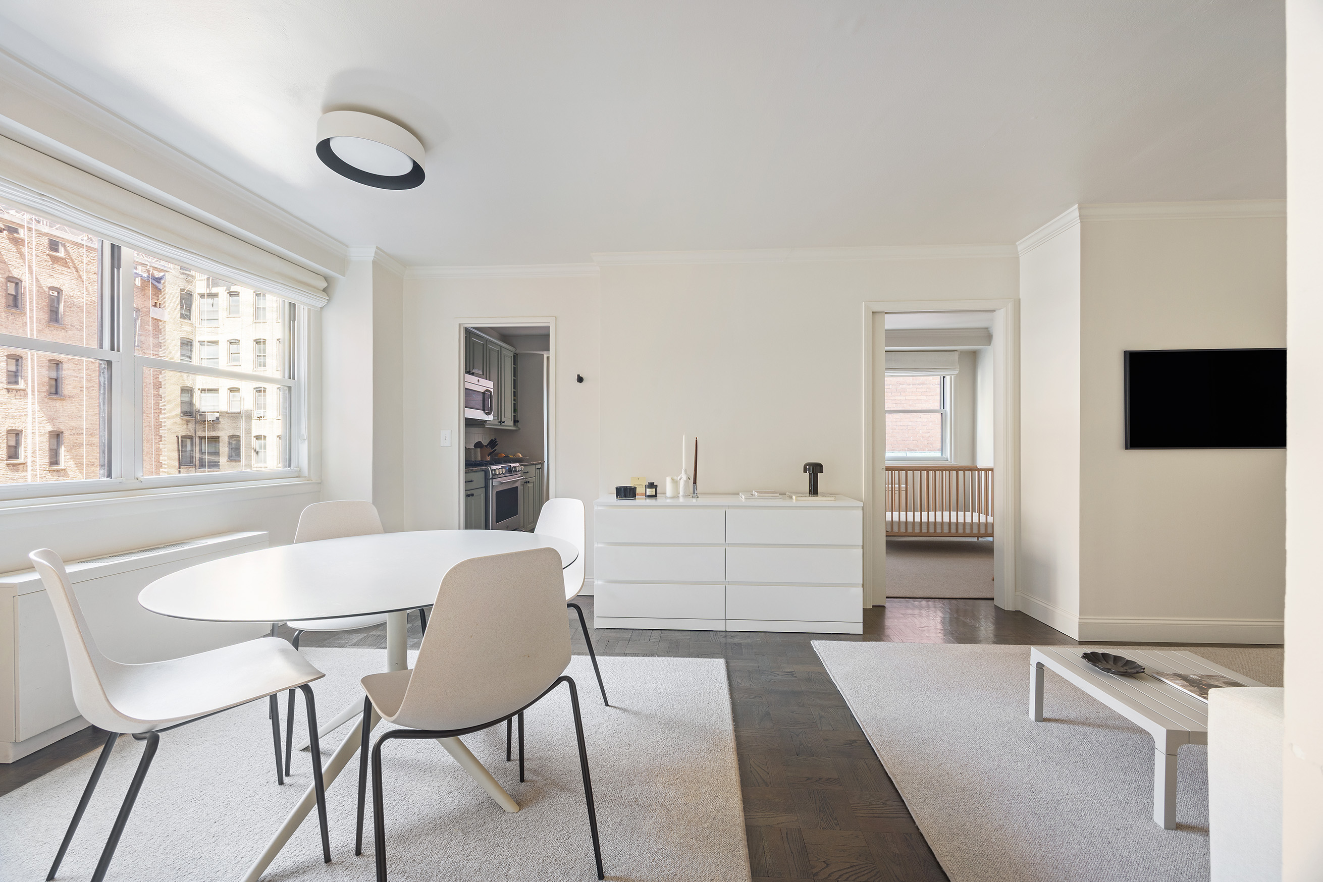 123 East 75th Street, Unit 6B Manhattan, NY 10021 - Photo 5 of 13 a view of a dining room with furniture and window