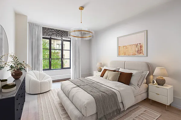 215 Sullivan Street, Unit THC Manhattan, NY 10012 - Photo 7 of 16 a bedroom with a bed and a chandelier