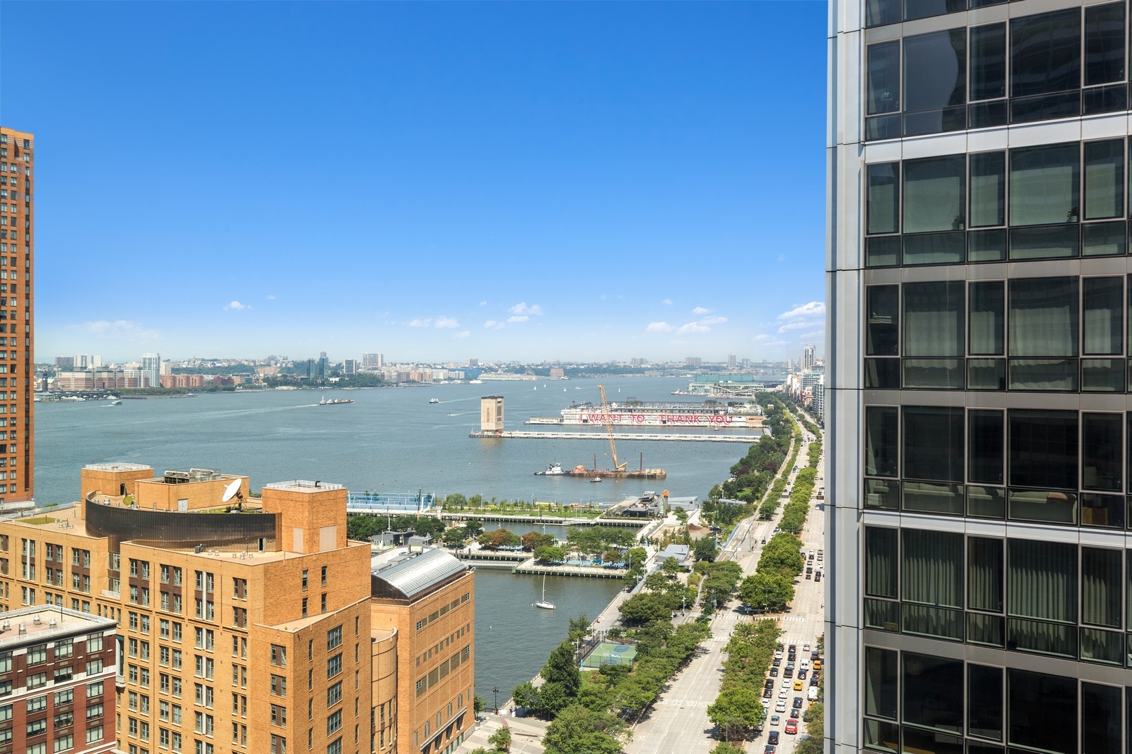 101 Warren Street, Unit 2420 Manhattan, NY 10007 - Photo 20 of 23 a view of a lake with a large building