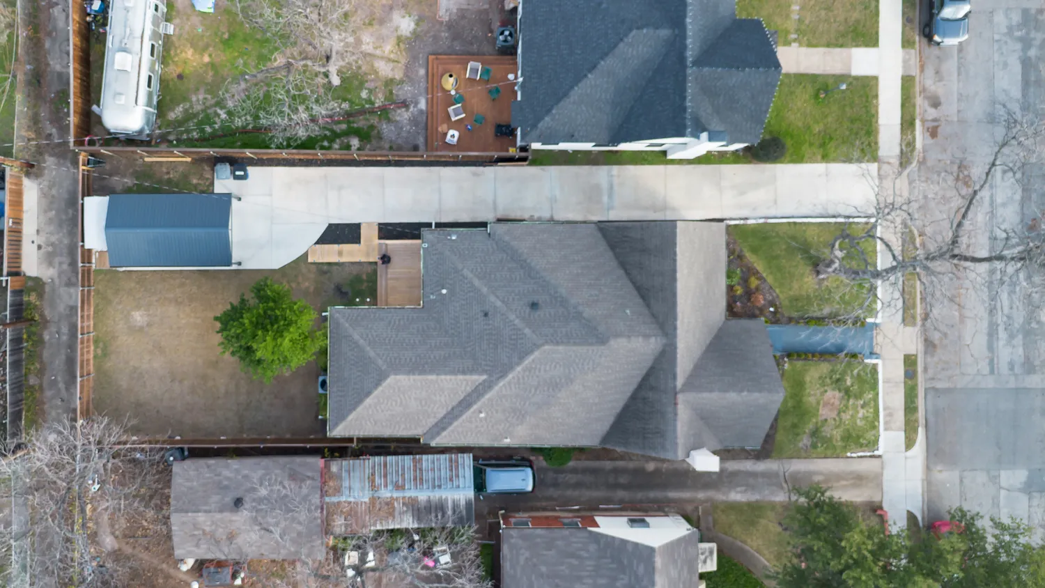 an aerial view of residential houses with outdoor space