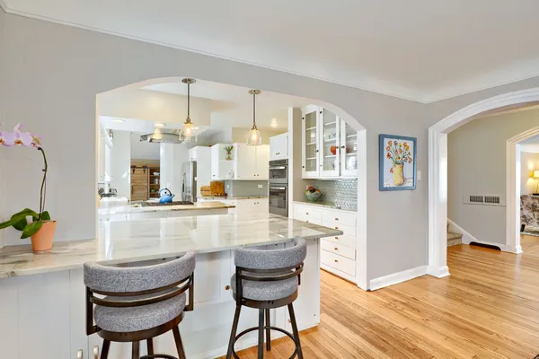 a kitchen with a table and chairs