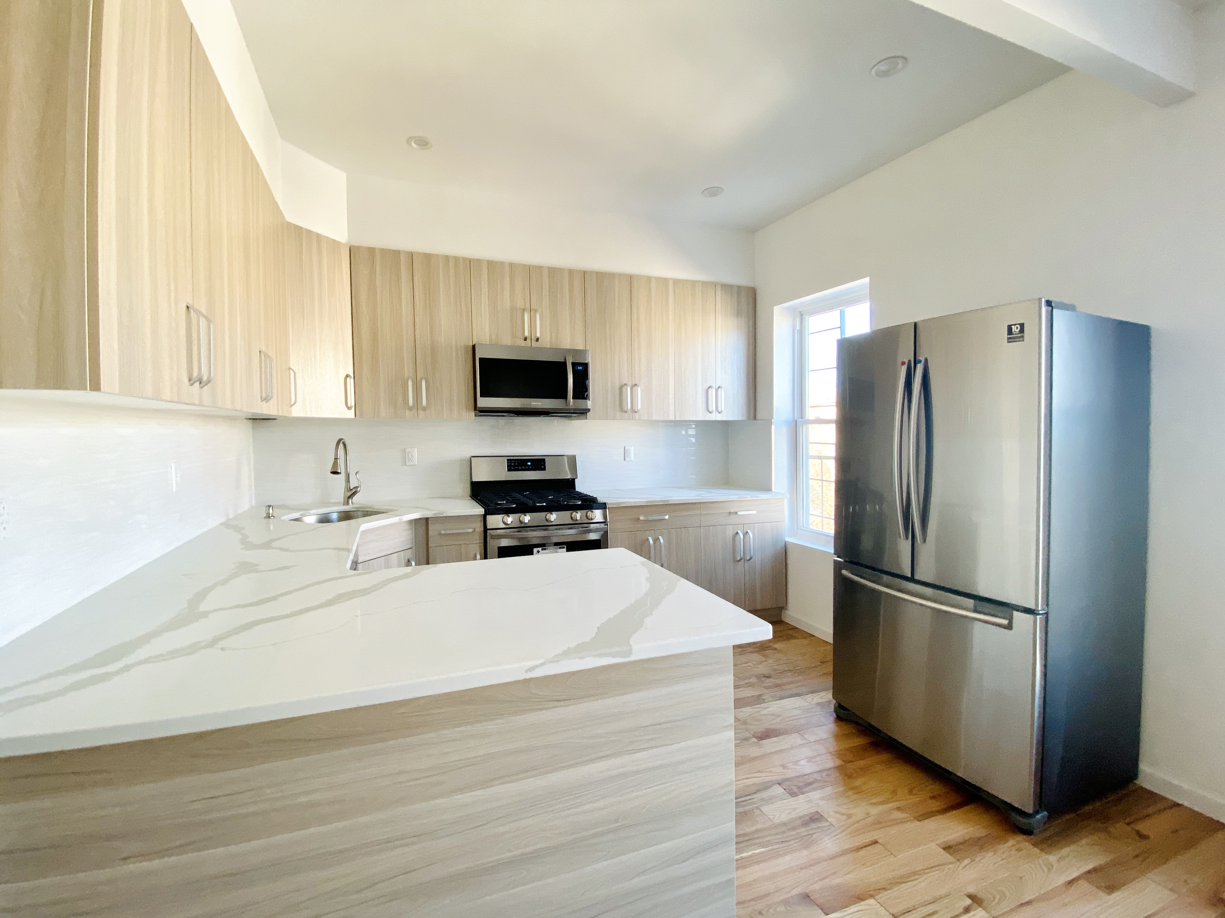 175 Luquer Street, Unit 4 Brooklyn, NY 11231 - Photo 13 of 21 a kitchen with a refrigerator sink and microwave
