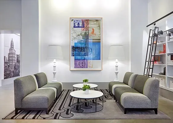 a living room with furniture and a rug