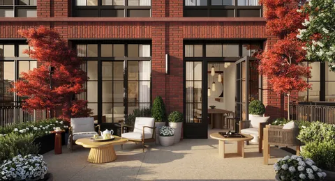 a view of a patio with couches table and chairs and potted plants