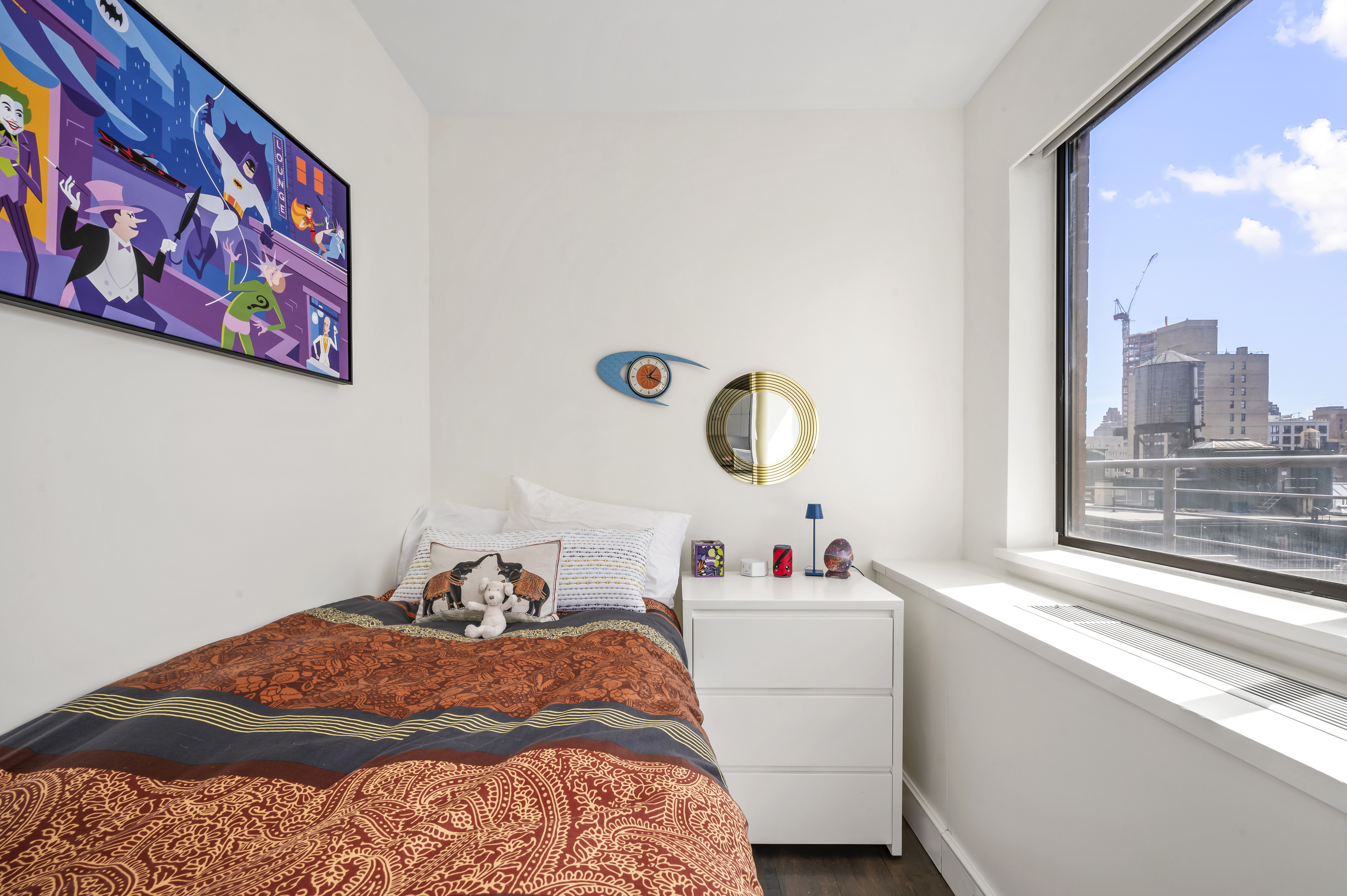 131 East 81st Street, Unit PH15 Manhattan, NY 10028 - Photo 10 of 11 a bedroom with a bed and a painting on the wall