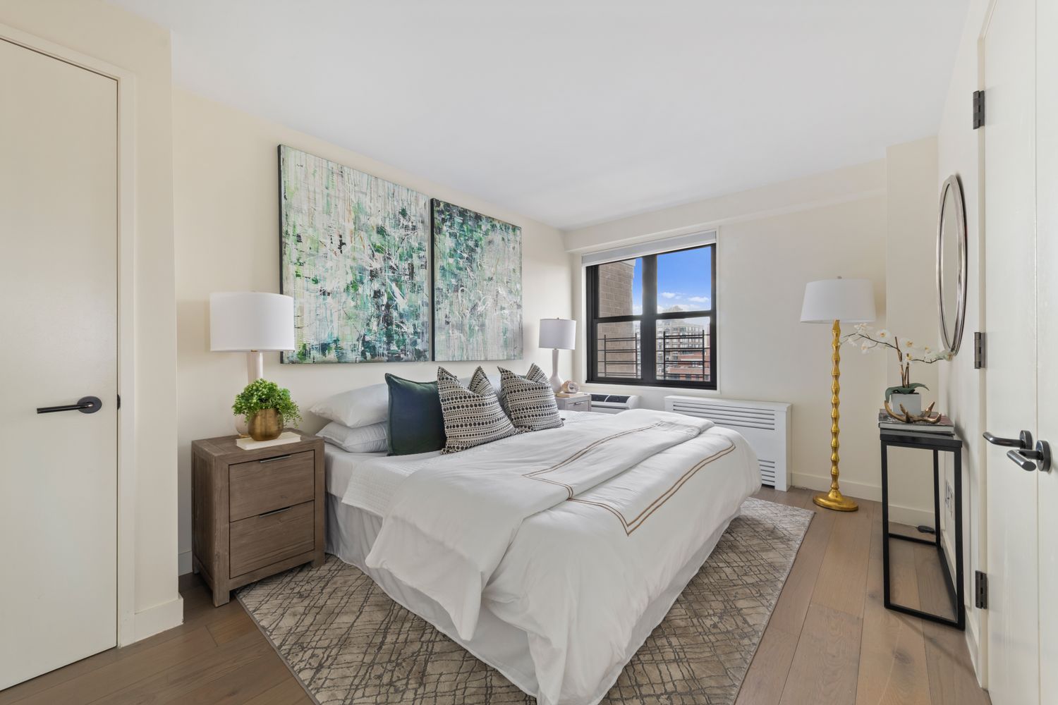 175 West 95th Street, Unit 19F Manhattan, NY 10025 - Photo 9 of 16 a bedroom with a bed and a large window