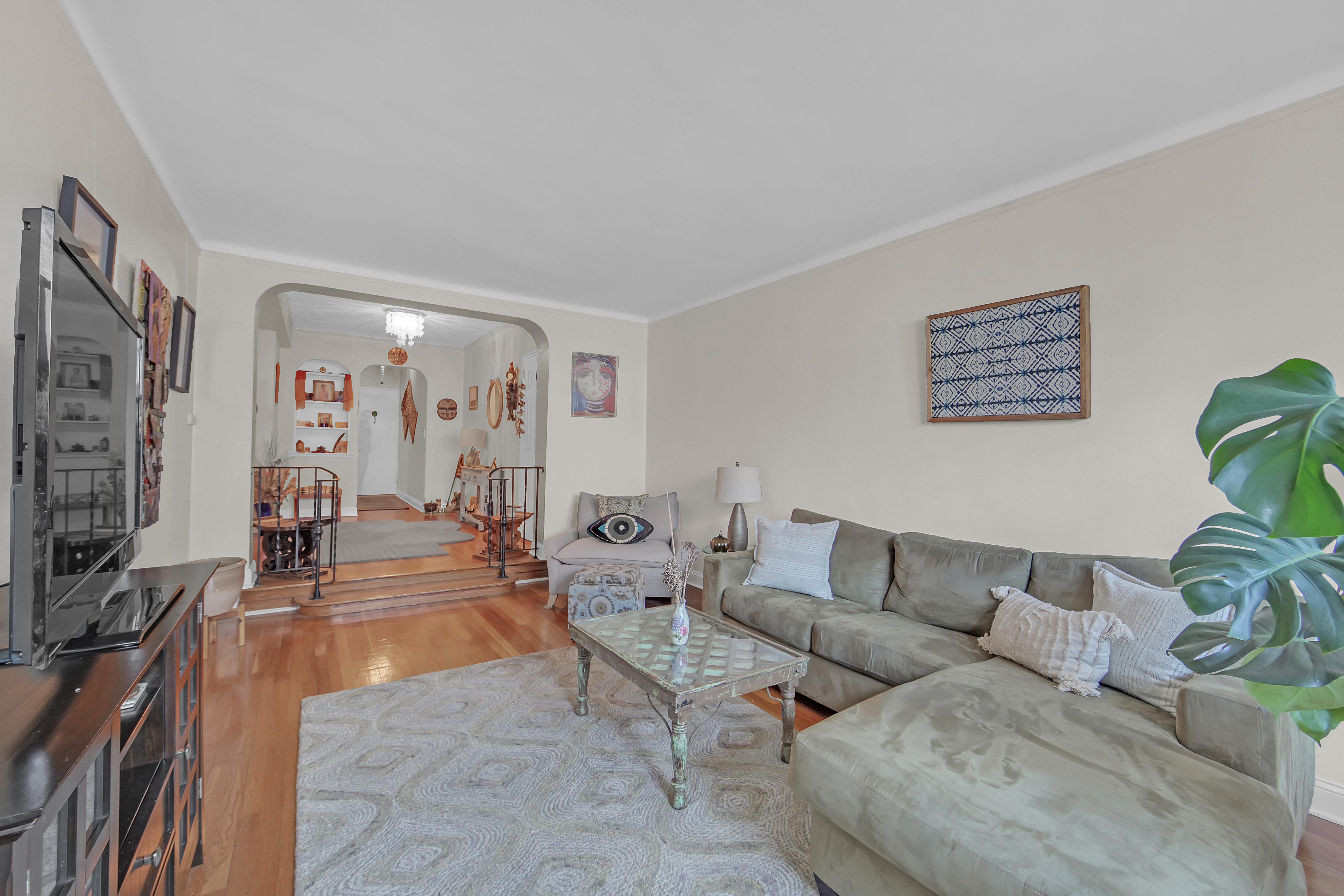 55 East 190th Street, Unit 59 Bronx, NY 10468 - Photo 2 of 14 a living room with furniture and wooden floor