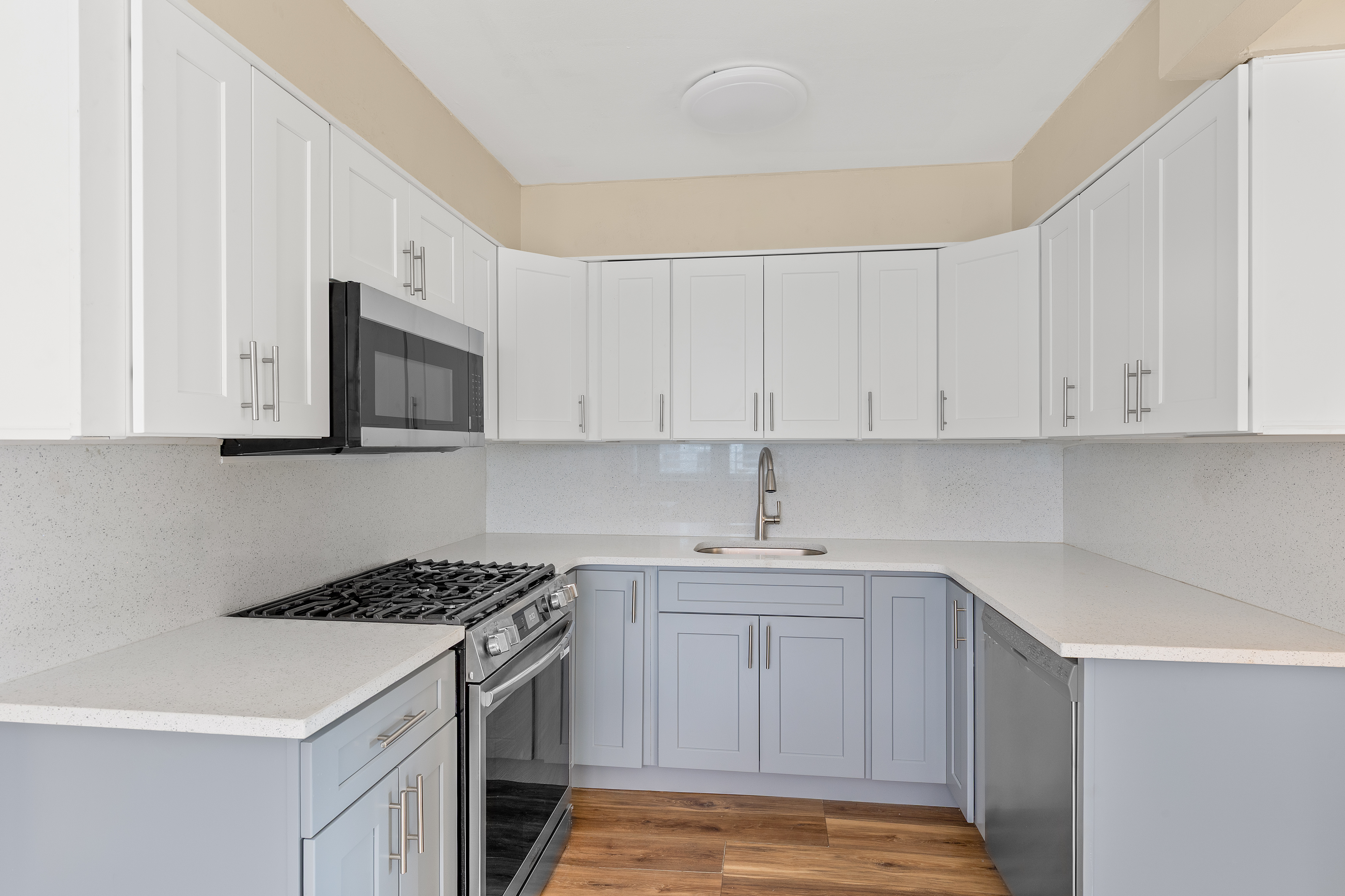 701 Rockaway Parkway, Unit 2F Brooklyn, NY 11236 - Photo 4 of 9 a kitchen with stainless steel appliances granite countertop a sink stove and microwave