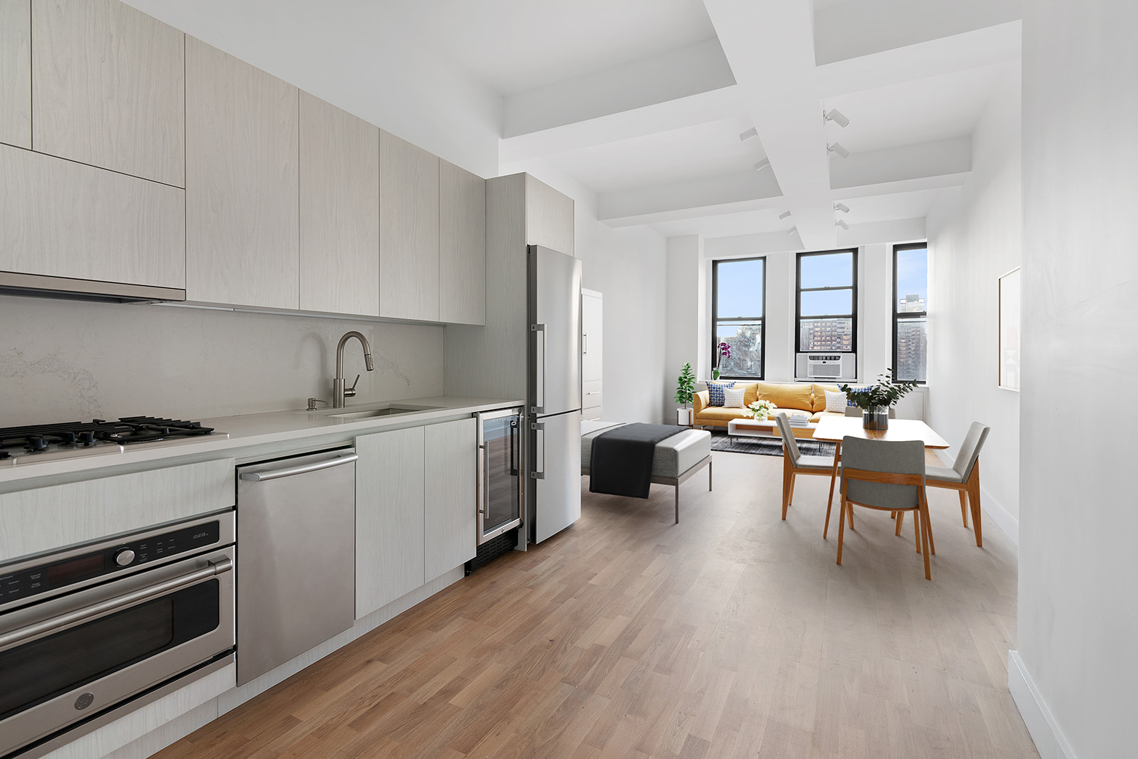 315 7th Avenue, Unit 11E Manhattan, NY 10001 - Photo 2 of 7 a kitchen with sink cabinets and stove top oven
