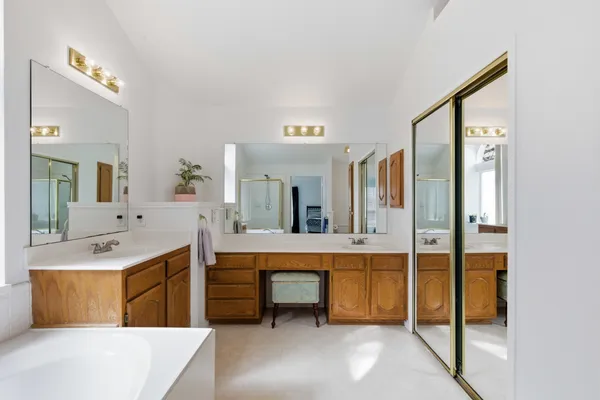a large kitchen with kitchen island a sink stainless steel appliances and cabinets