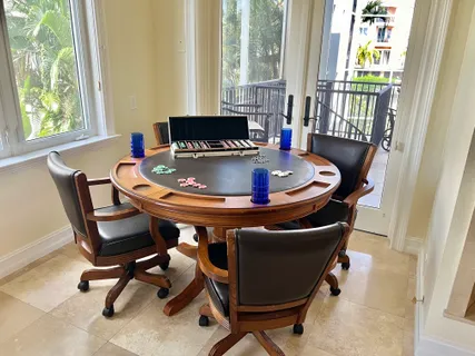 a dining room with furniture and window