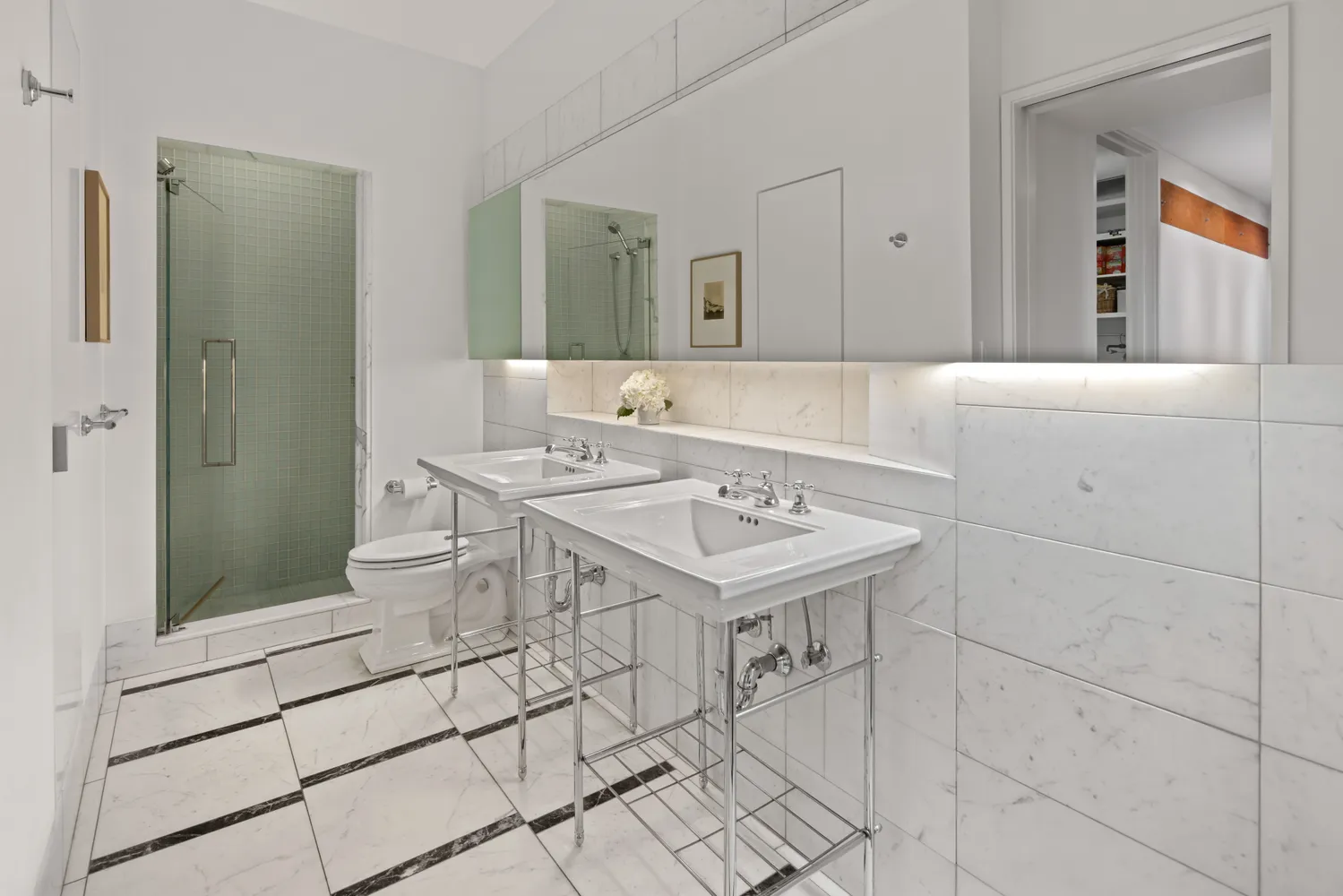 a bathroom with a sink toilet and mirror