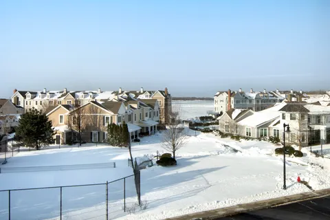 a bedroom with a bed and a lamp