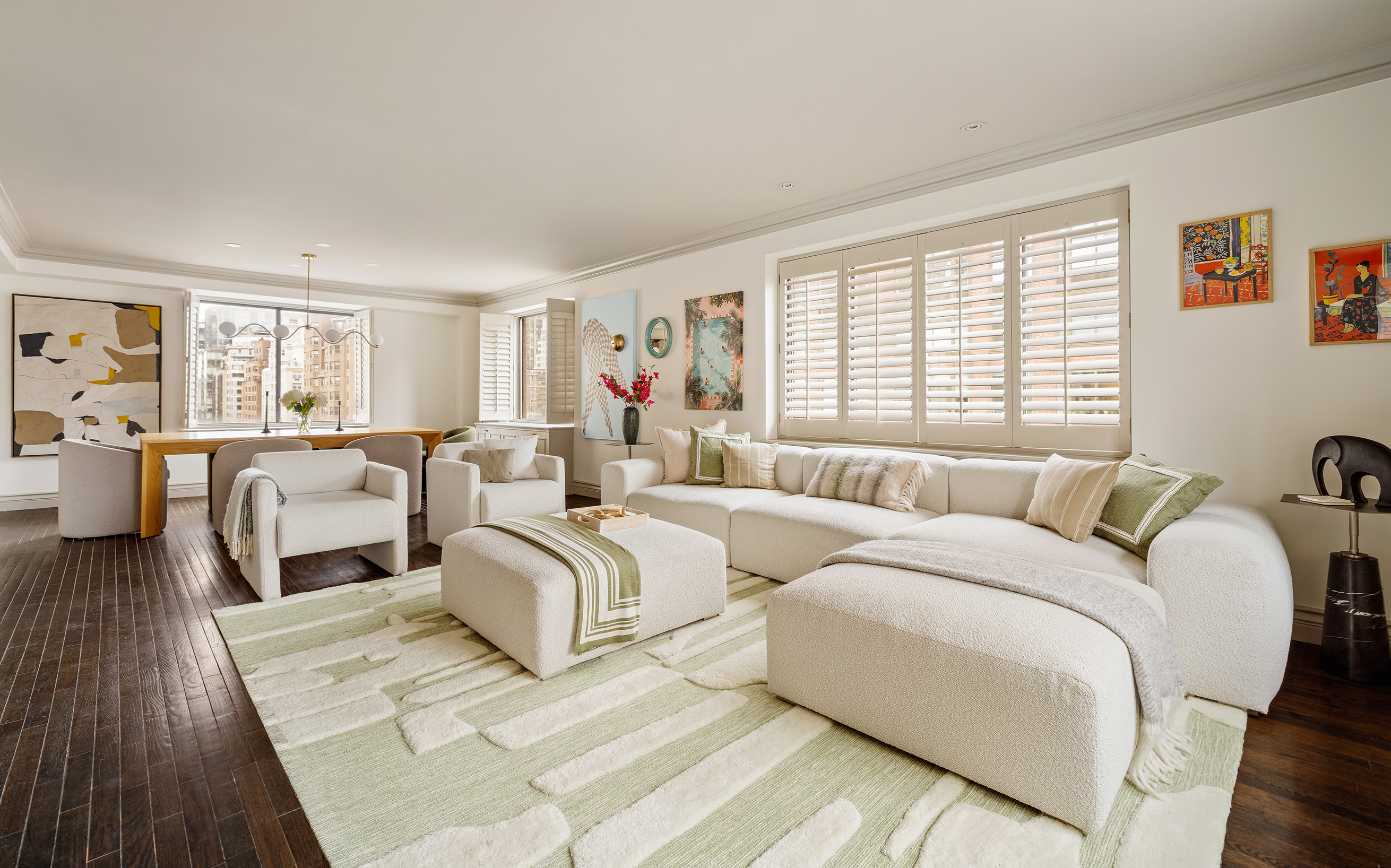 a bedroom with two beds and a large window