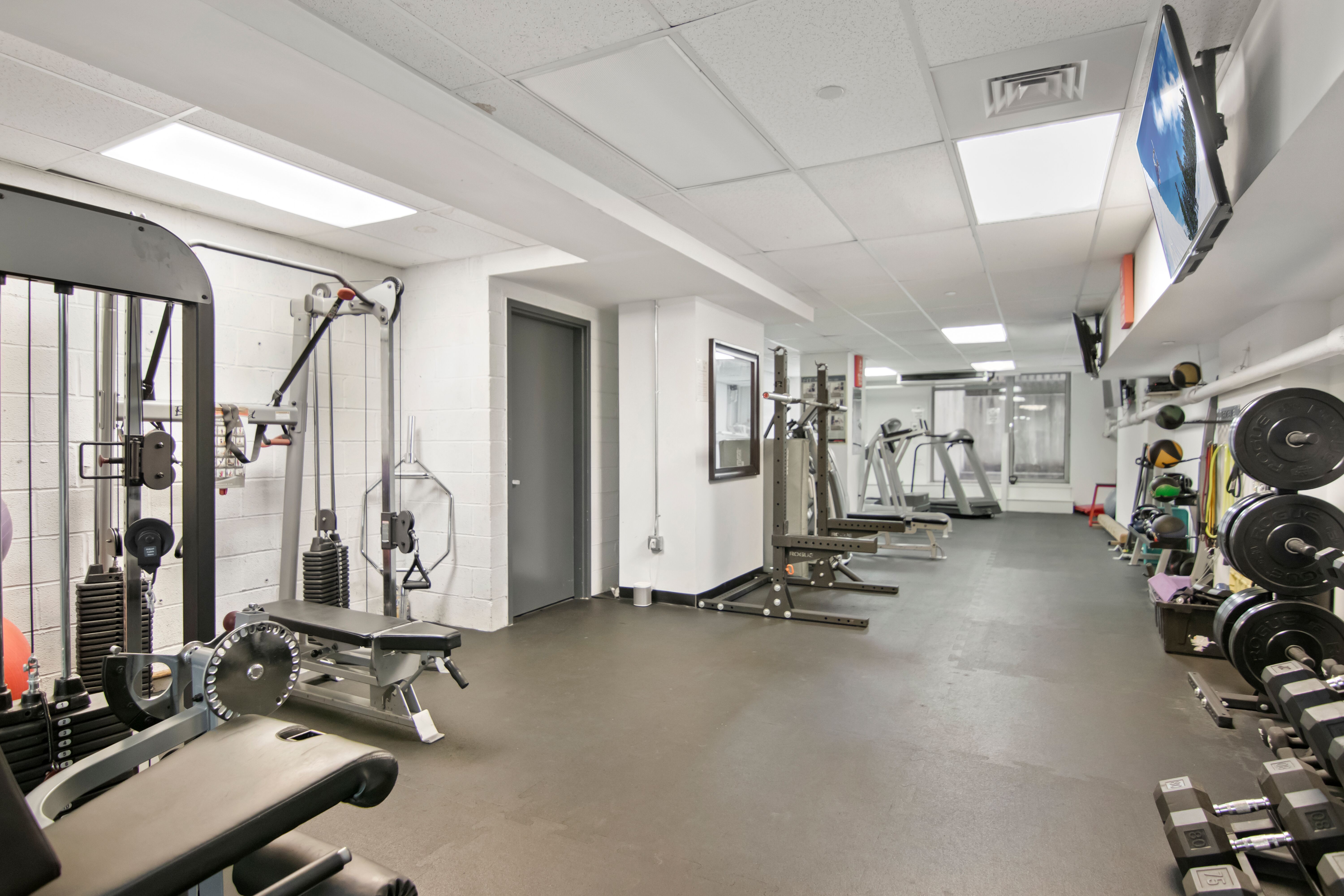 224 West 18th Street, Unit 6C Manhattan, NY 10011 - Photo 18 of 21 a view of a room with gym equipment