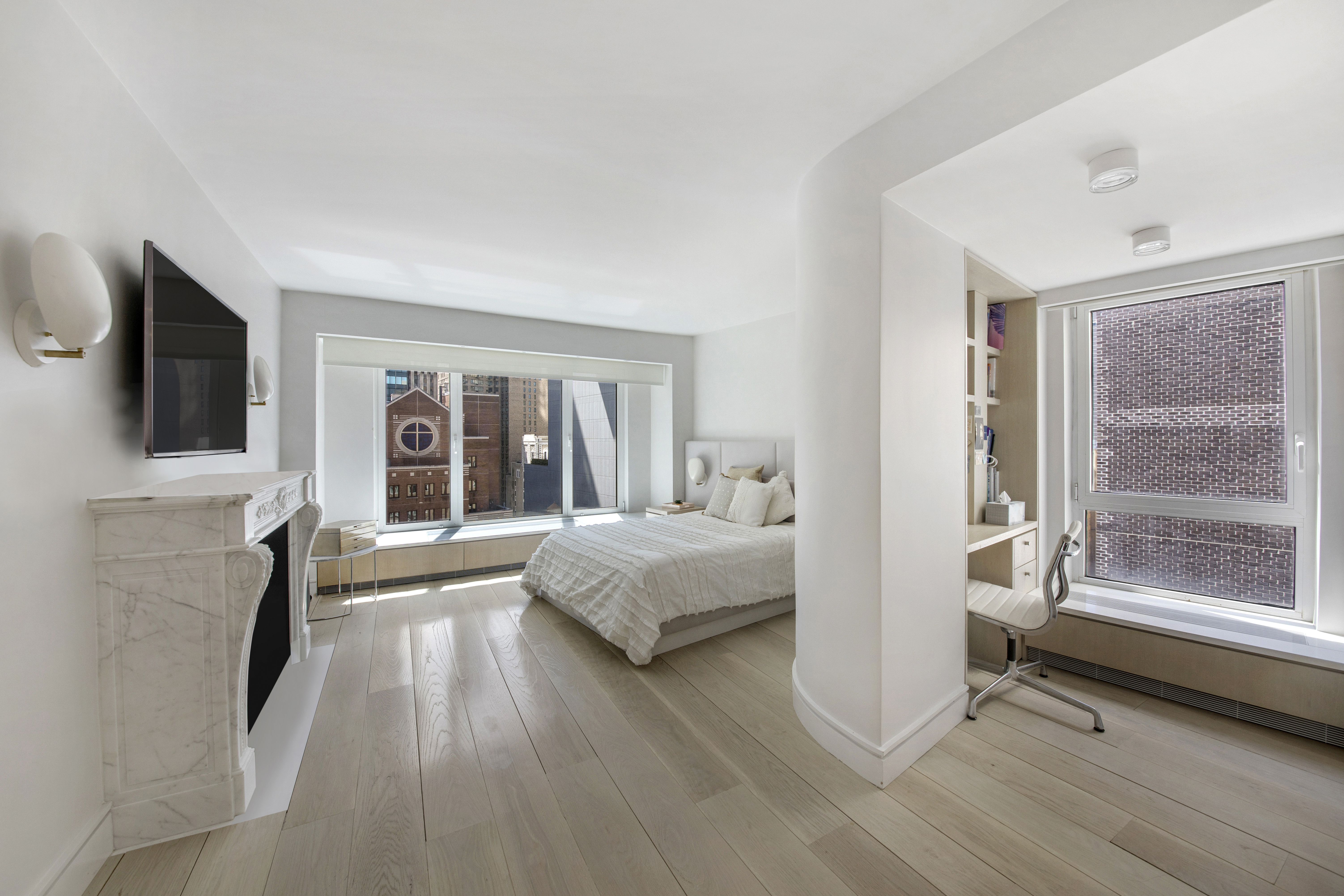 200 Central Park South, Unit 20DEF Manhattan, NY 10019 - Photo 12 of 16 a living room with furniture and a flat screen tv