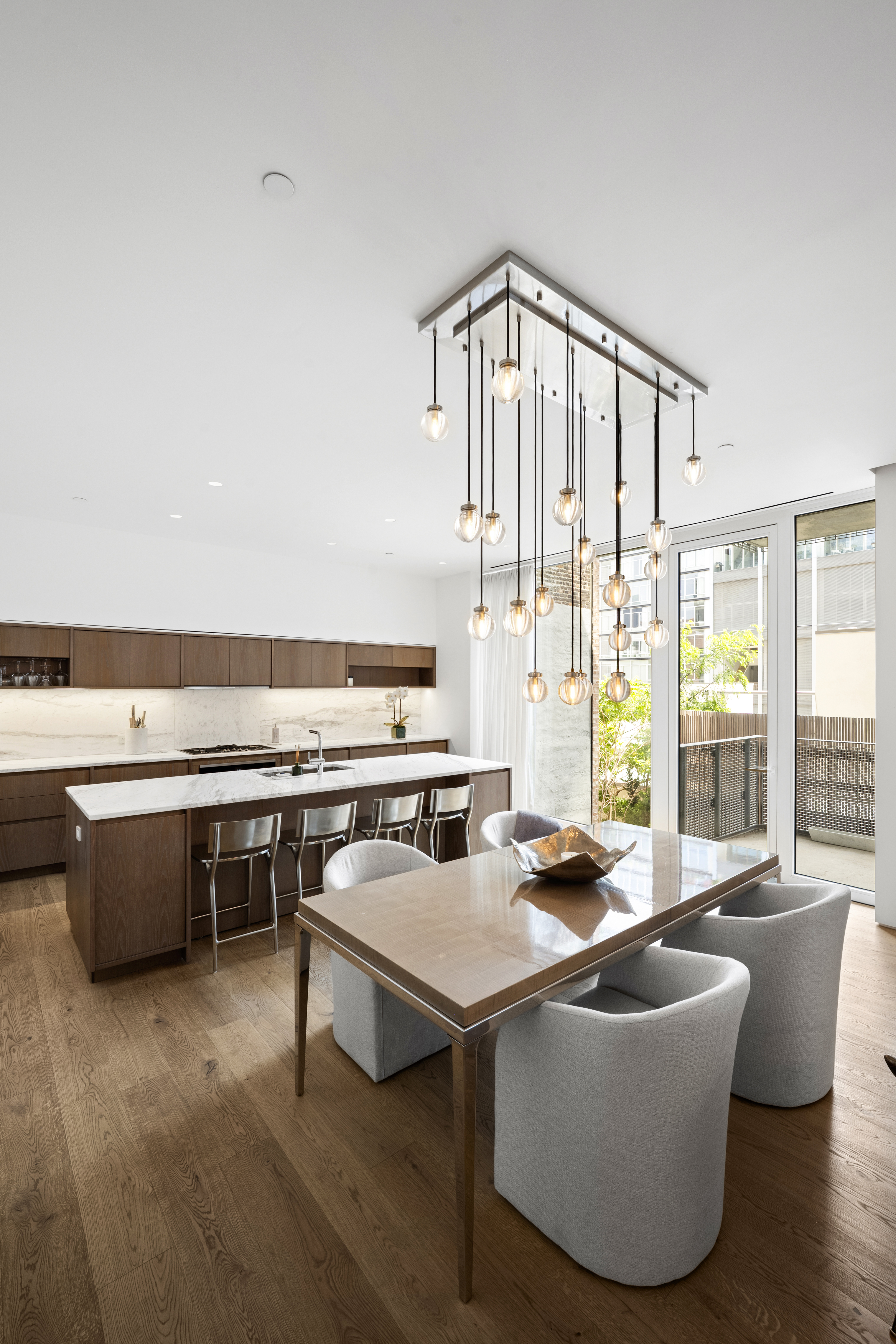 532 West 20th Street, Unit 4 Manhattan, NY 10011 - Photo 5 of 23 a living room with furniture a flat screen tv and outdoor view