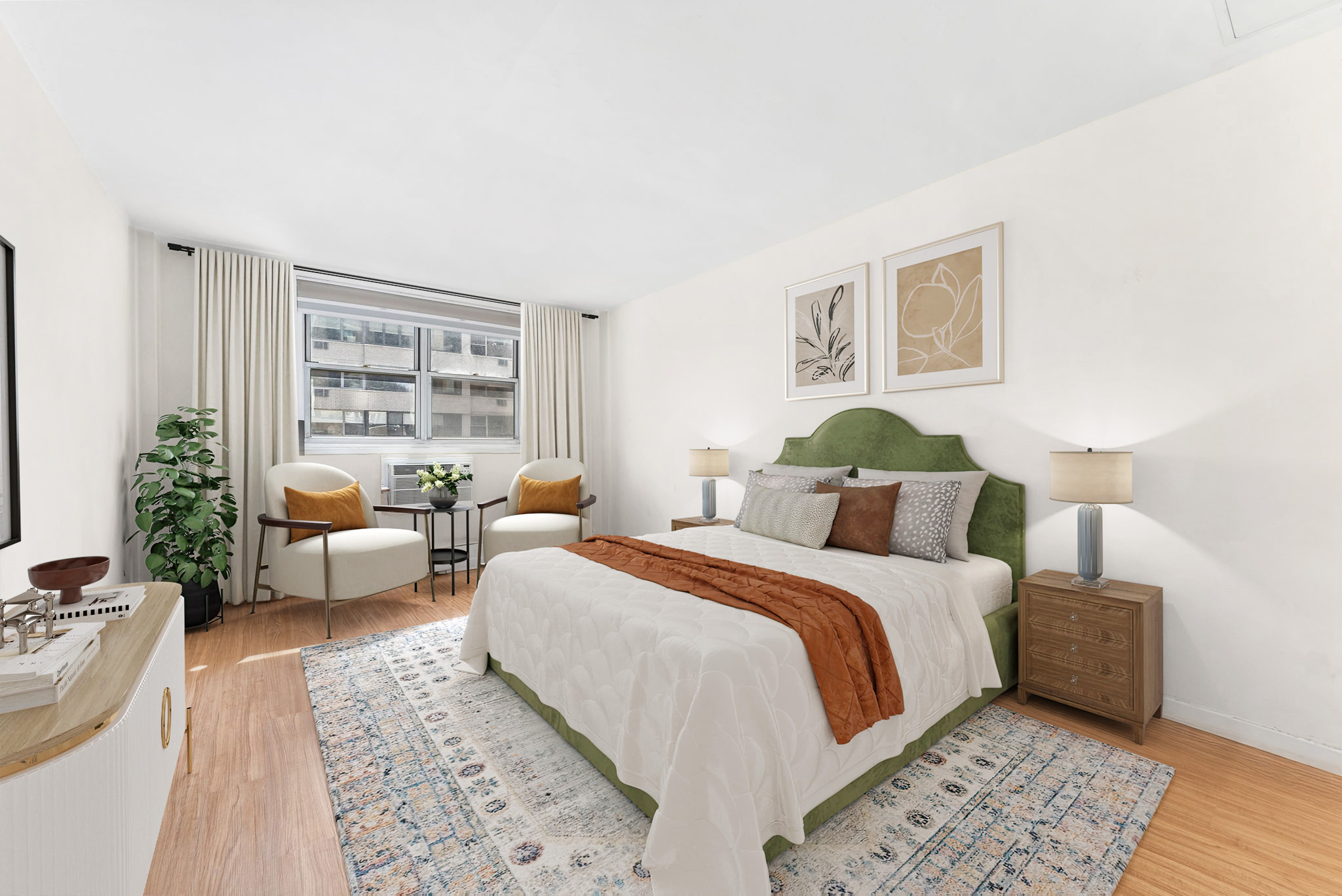 40 Sutton Place, Unit 9J Manhattan, NY 10022 - Photo 3 of 11 a bedroom with a large bed and a couch