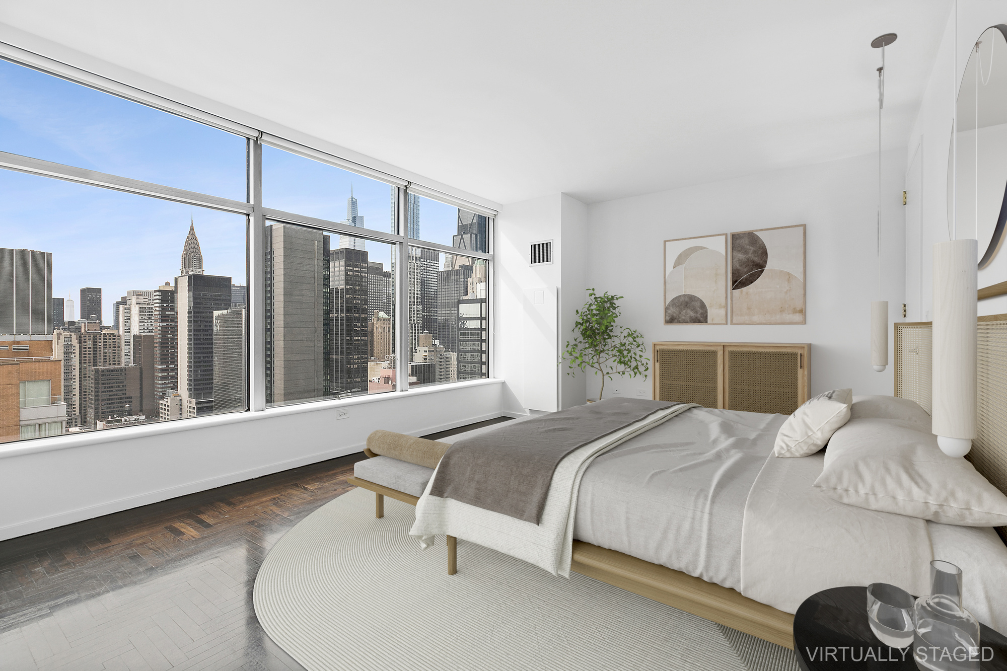 250 East 54th Street, Unit 35A Manhattan, NY 10022 - Photo 3 of 13 a bedroom with a large bed and a window