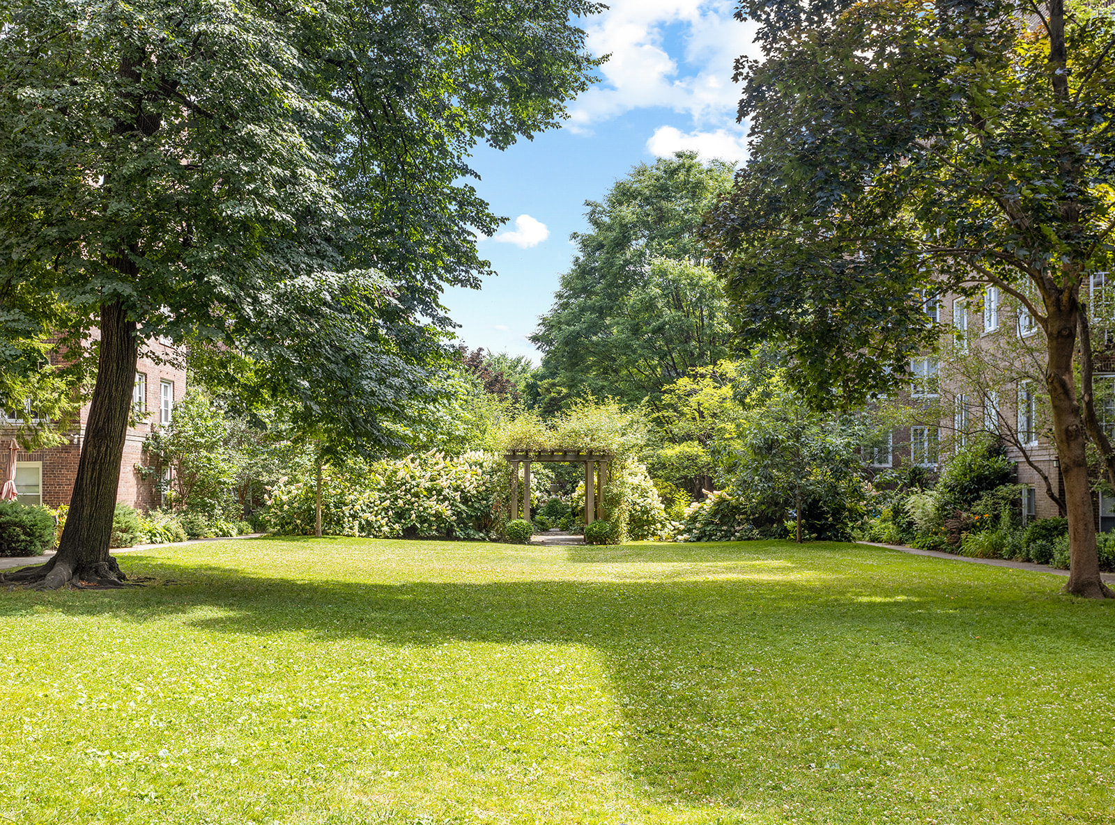 35-14 77th Street, Unit 52 Queens, NY 11372 - Photo 8 of 11 a view of a yard with a trees
