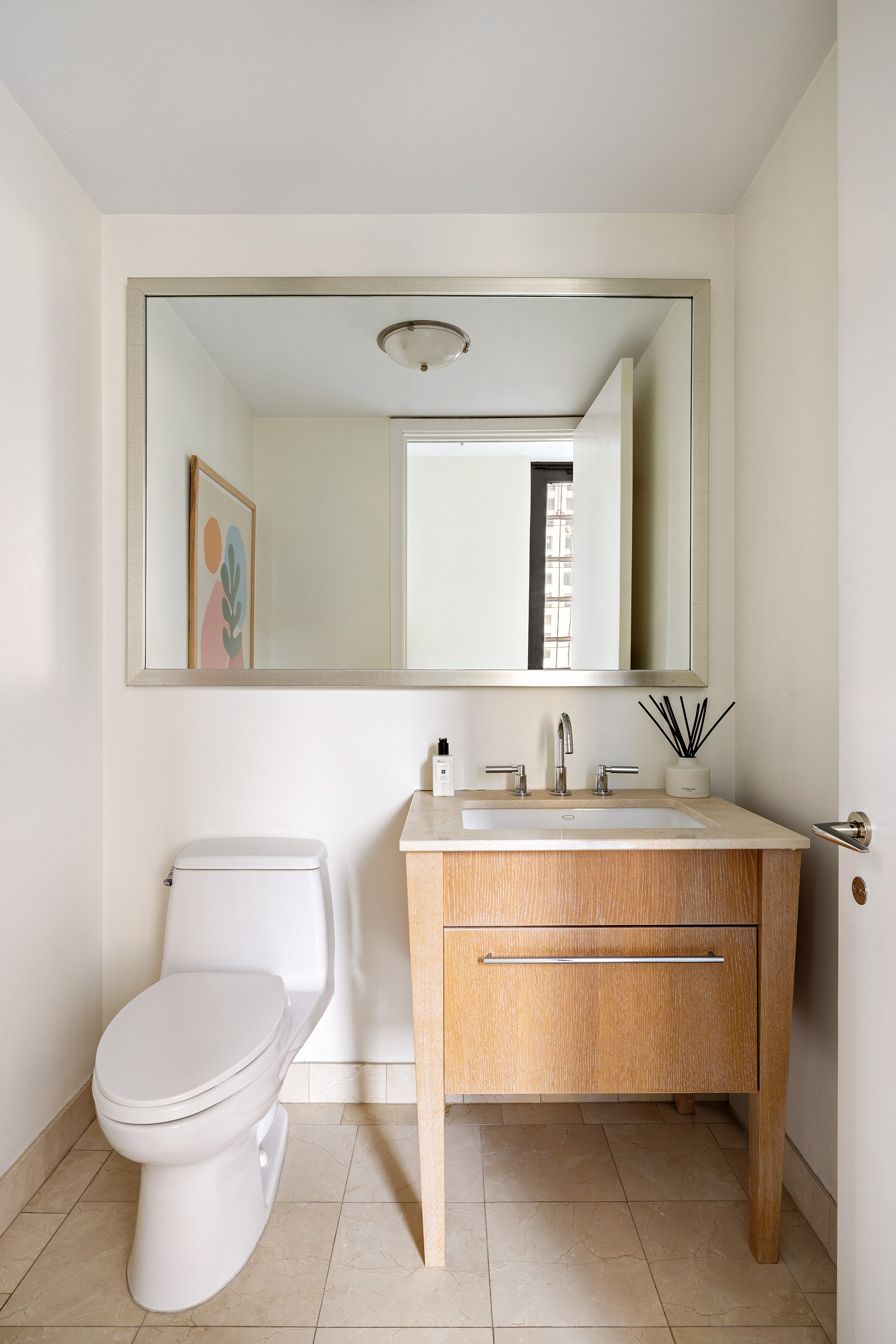 110 Central Park South, Unit PH1 Manhattan, NY 10019 - Photo 19 of 26 a bathroom with a toilet a sink and mirror