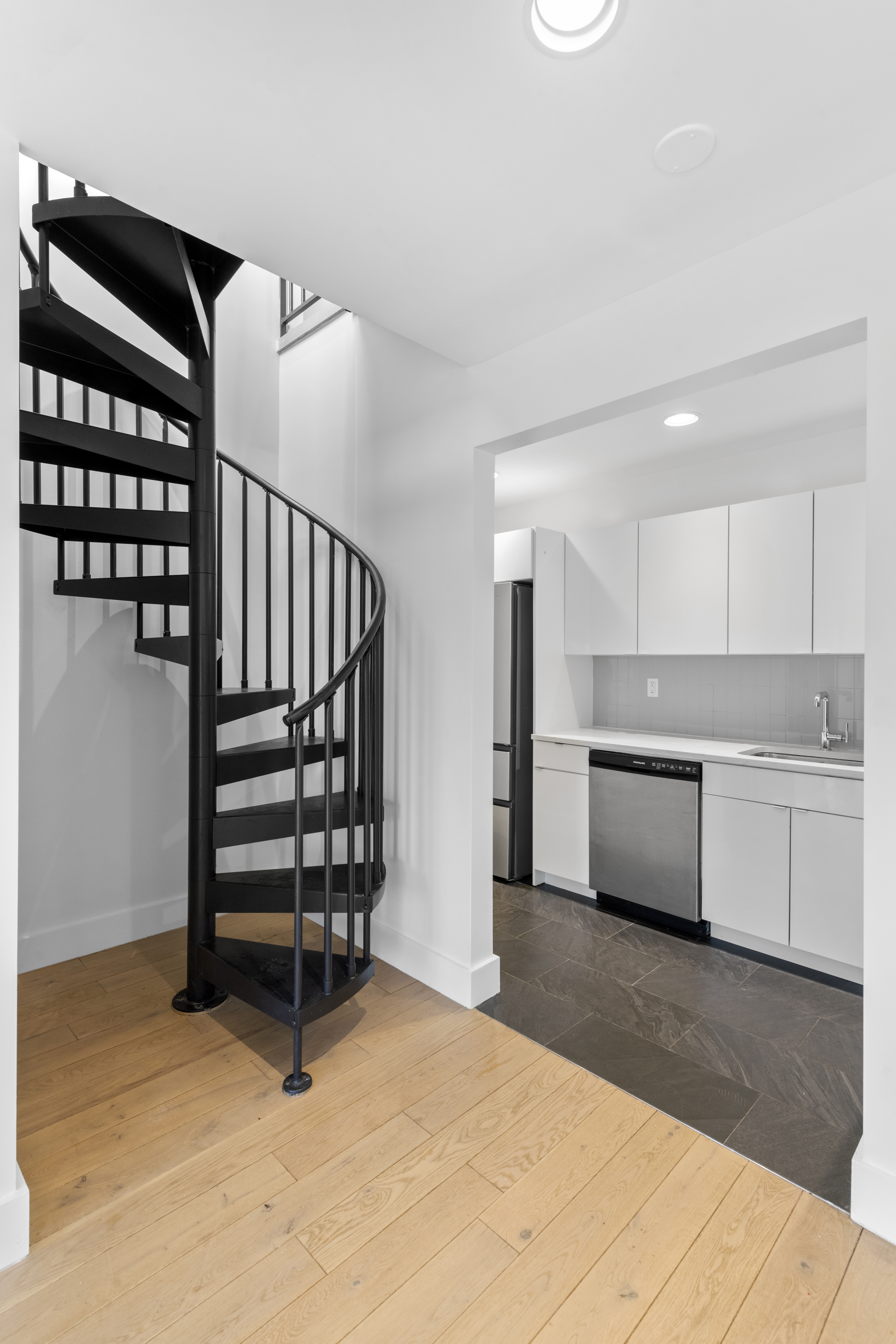 1164 Greene Avenue, Unit PHB Brooklyn, NY 11221 - Photo 7 of 16 a view of a kitchen with a sink and cabinets