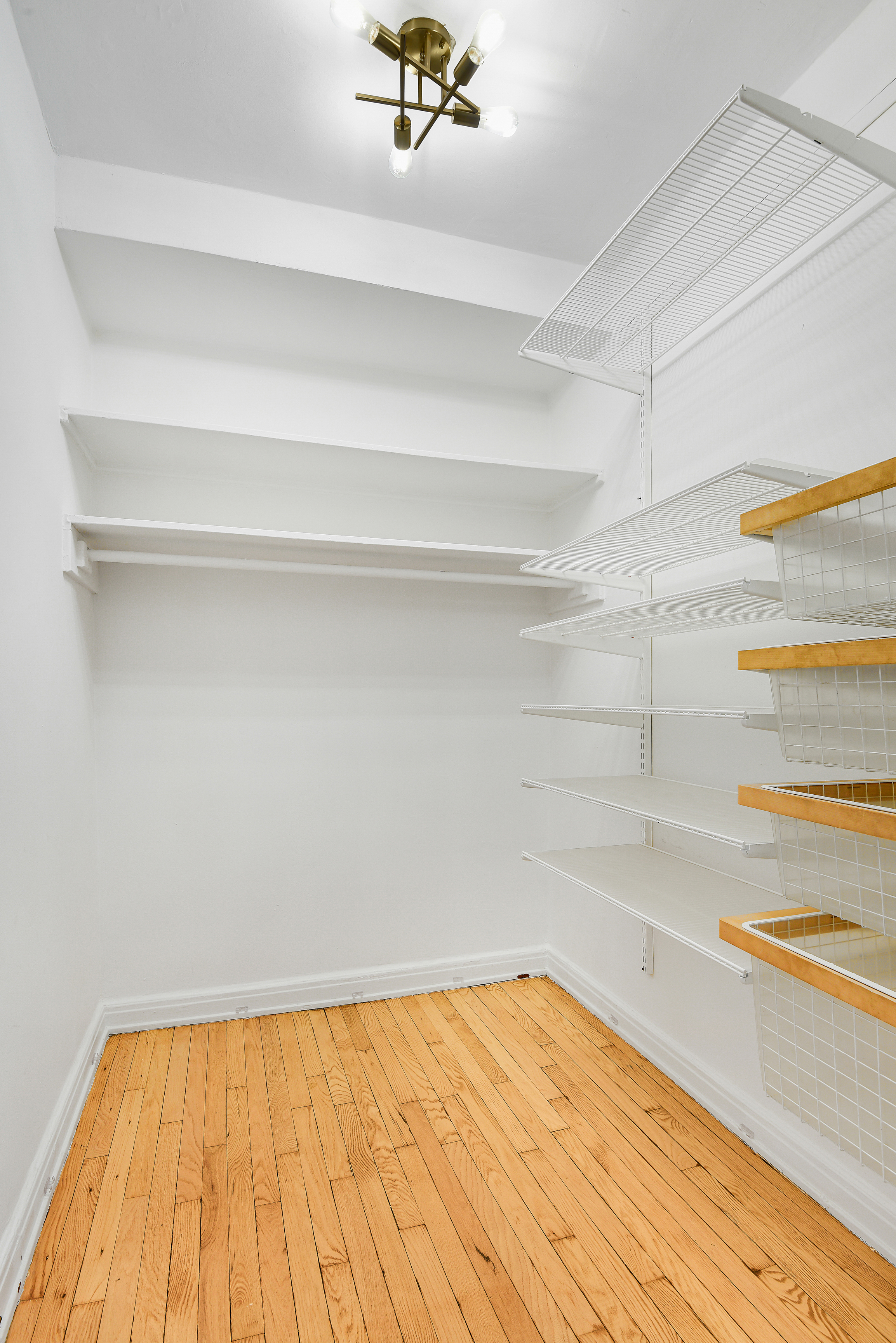 333 West 56th Street, Unit 3H Manhattan, NY 10019 - Photo 6 of 7 a view of a room with a wooden floor