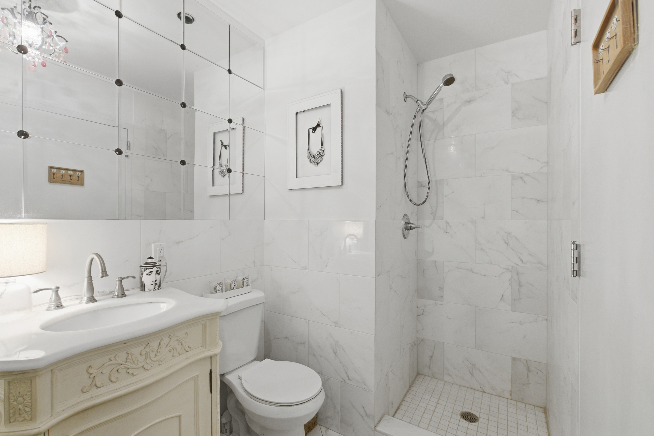 127 West 123rd Street Manhattan, NY 10027 - Photo 23 of 28 a bathroom with a sink toilet vanity and shower