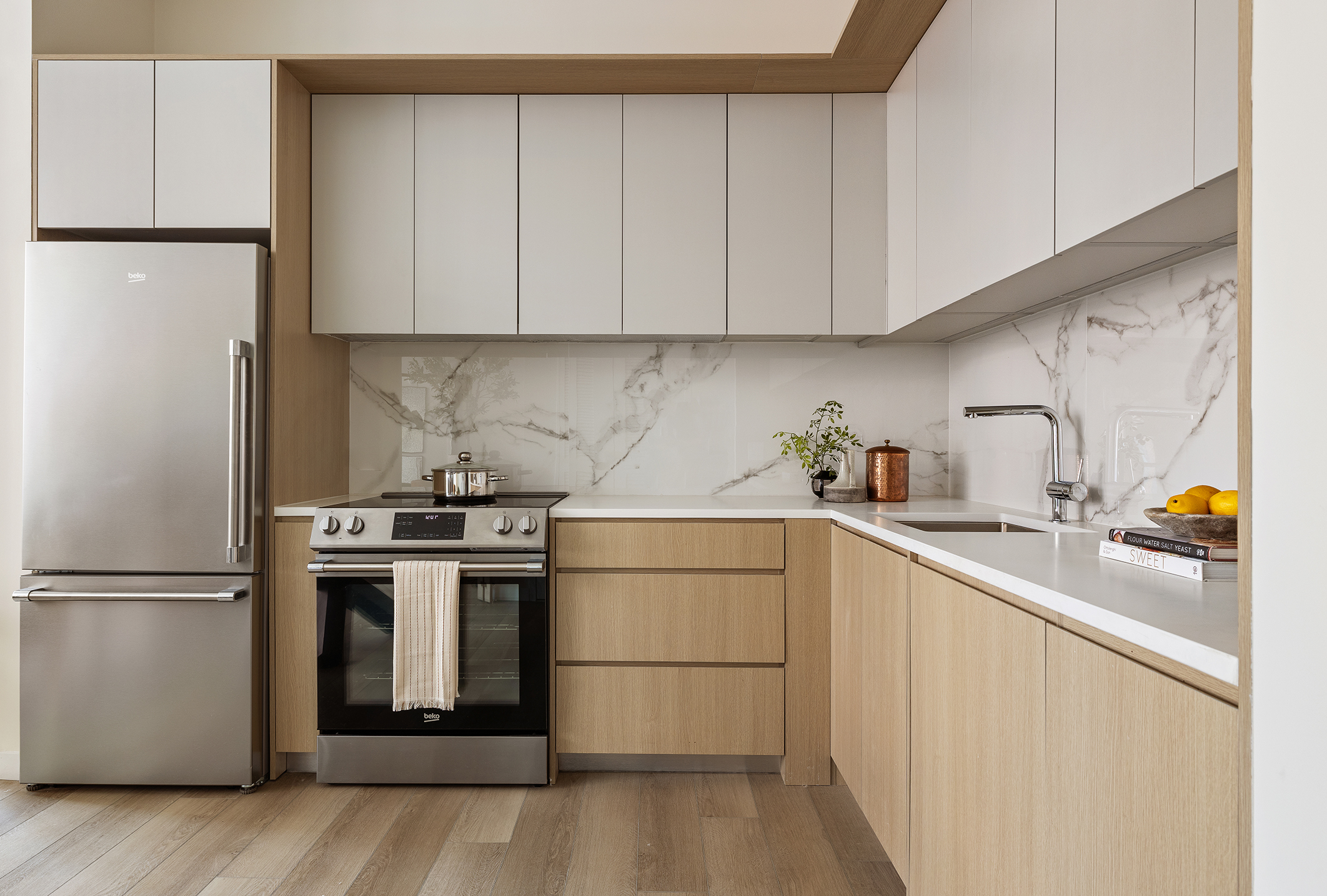 55 Paseo Place, Unit 305 Brooklyn, NY 11217 - Photo 2 of 8 a kitchen with a sink a stove and refrigerator