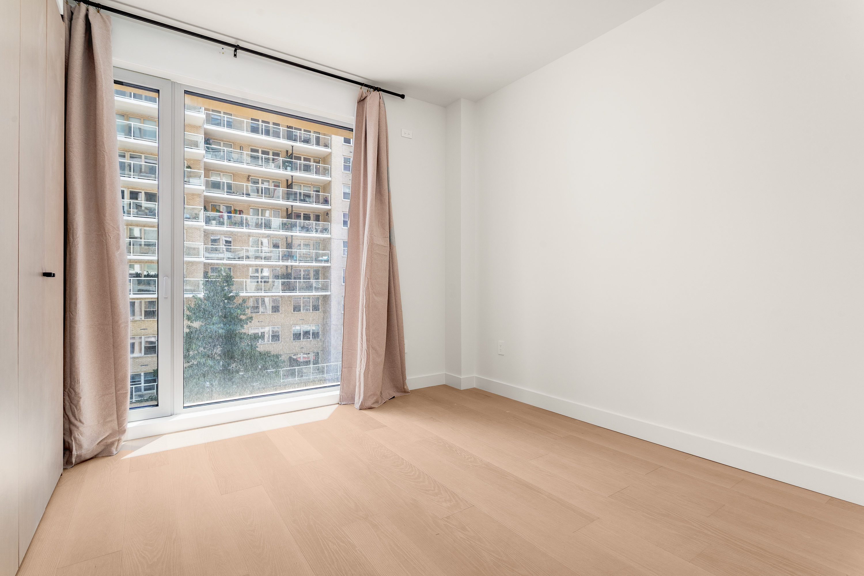 250 East 25th Street, Unit 4C Manhattan, NY 10010 - Photo 6 of 16 a view of an empty room with a window