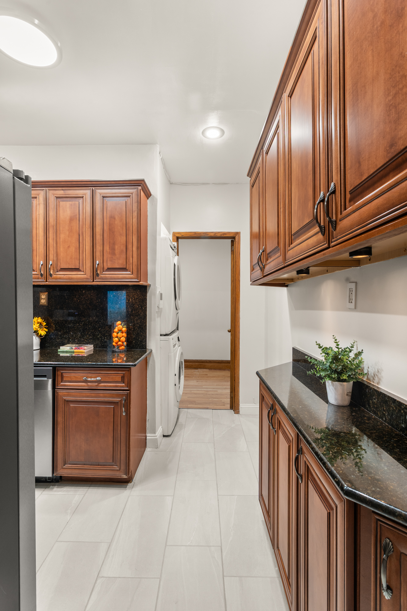 527 West 143rd Street, Unit 31 Manhattan, NY 10031 - Photo 9 of 29 a kitchen with stainless steel appliances granite countertop a refrigerator and a stove top oven