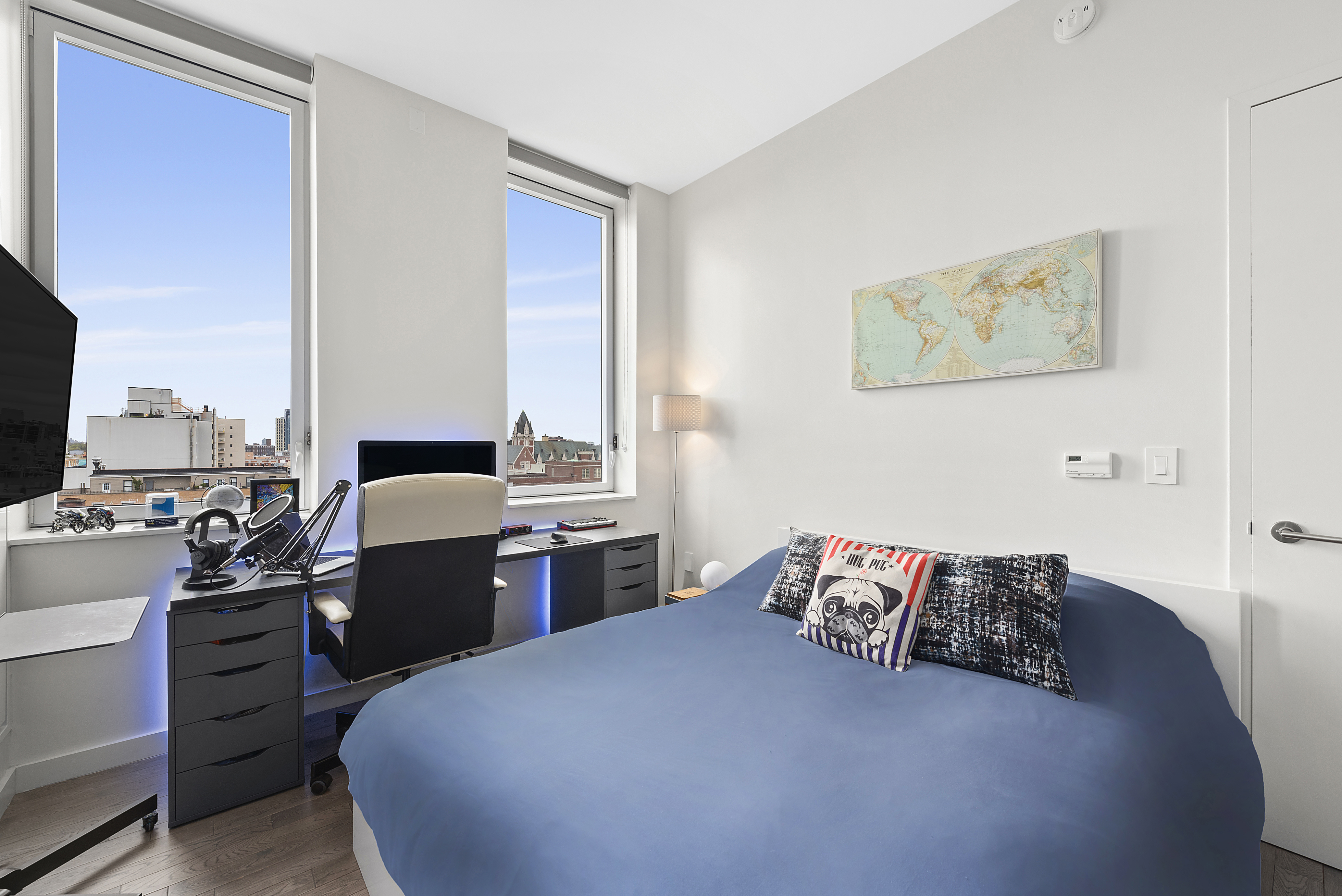 285 West 110th Street, Unit 9B Manhattan, NY 10026 - Photo 8 of 20 a bedroom with a bed and wooden floor