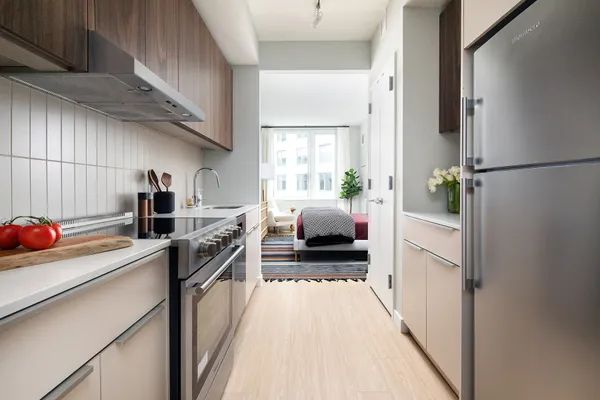 a kitchen with a sink and refrigerator