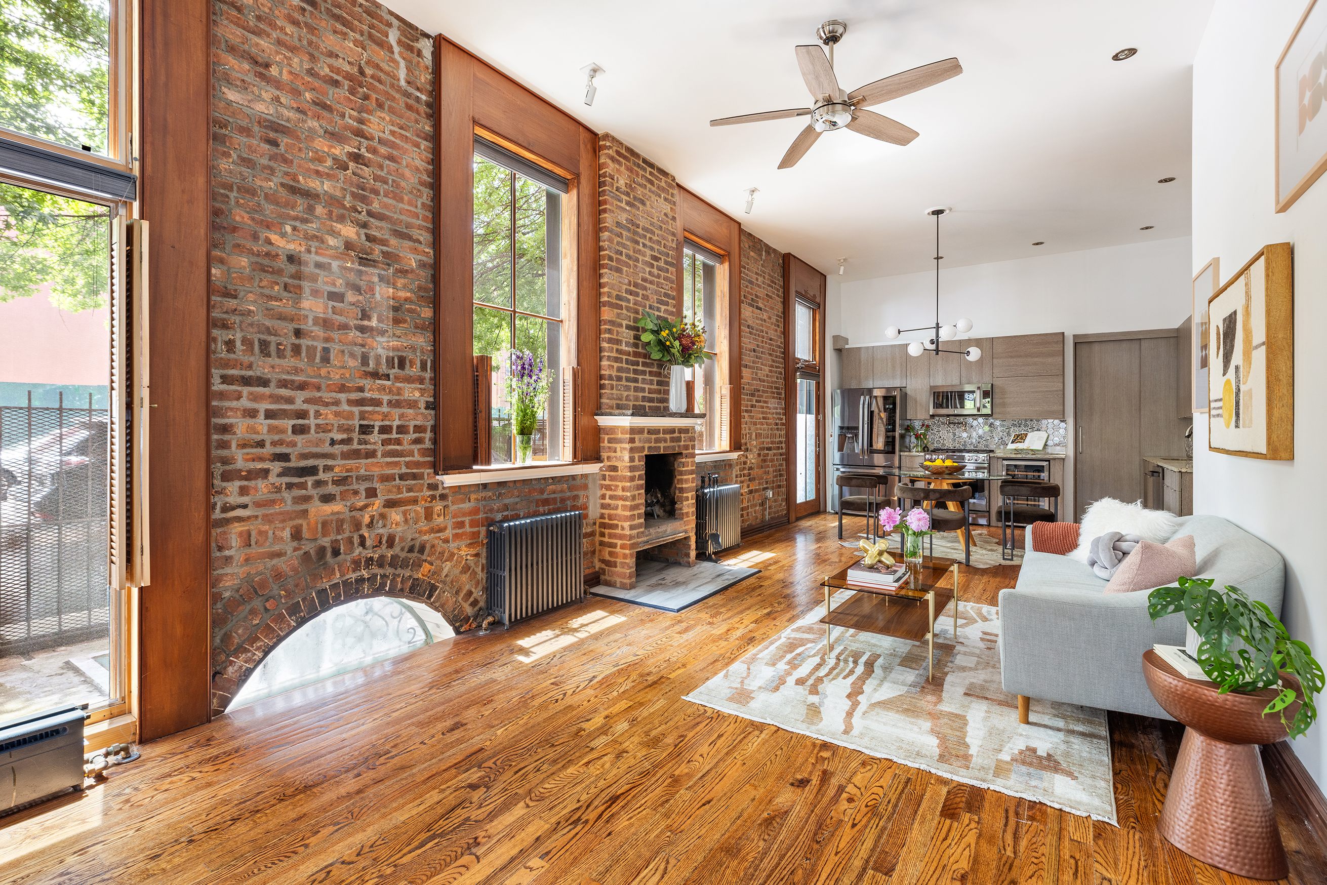 412 Classon Avenue Brooklyn, NY 11238 - Photo 4 of 30 a living room with furniture large window and wooden floor